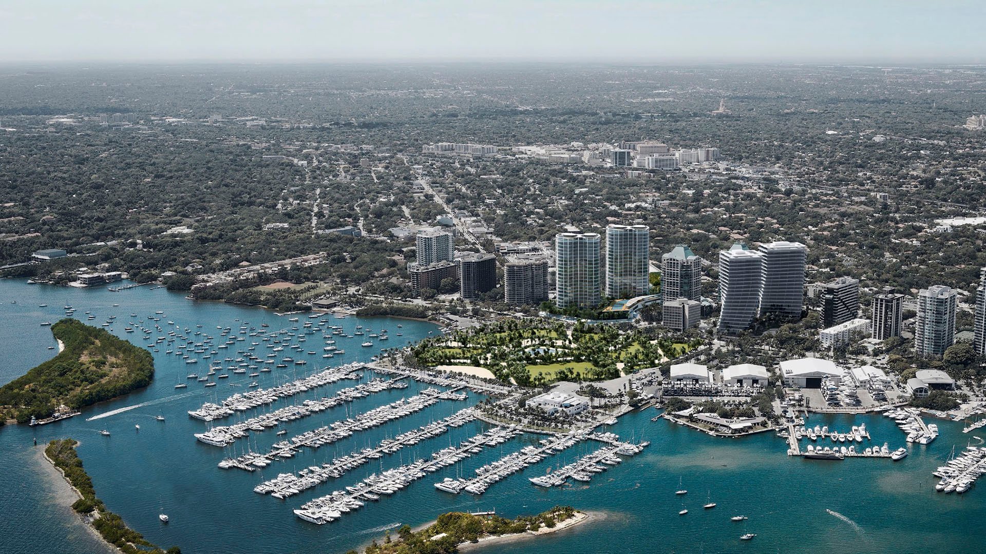 Aerial waterfront marina and neighborhood view showing docks, parkland and Park Grove in Coconut Grove, situating the luxury and ultra luxury condos on the bay.