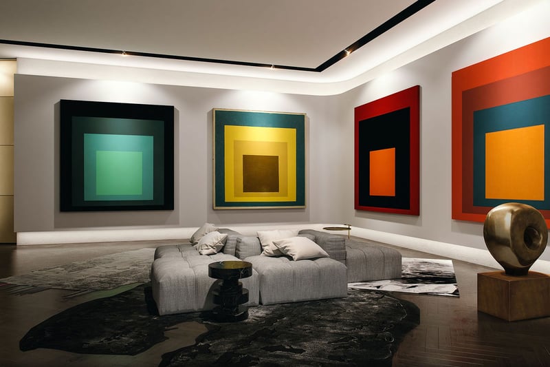 Art gallery lounge with oversized color block paintings, sculptural seating and dark wood floors at Park Grove in Coconut Grove, reflecting the luxury and ultra luxury condos aesthetic.
