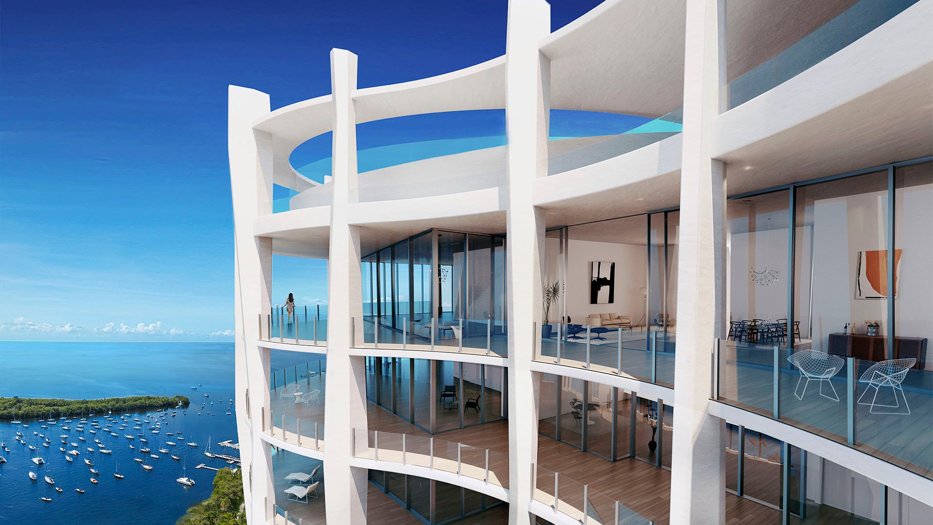 Upper balcony condo exterior with white columns, rounded terraces and open water views at Park Grove in Coconut Grove, defining the luxury and ultra luxury condos silhouette.