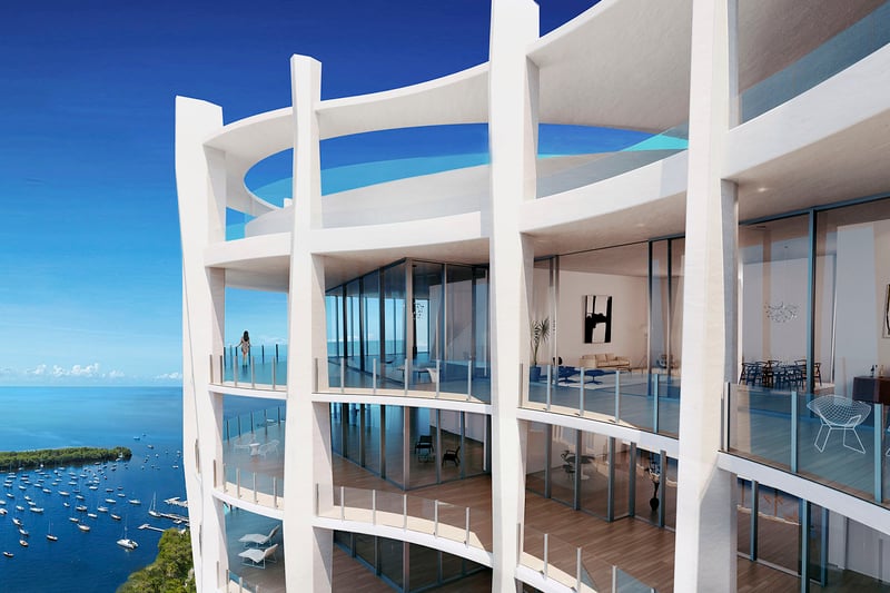 Upper balcony condo exterior with white columns, rounded terraces and open water views at Park Grove in Coconut Grove, defining the luxury and ultra luxury condos silhouette.