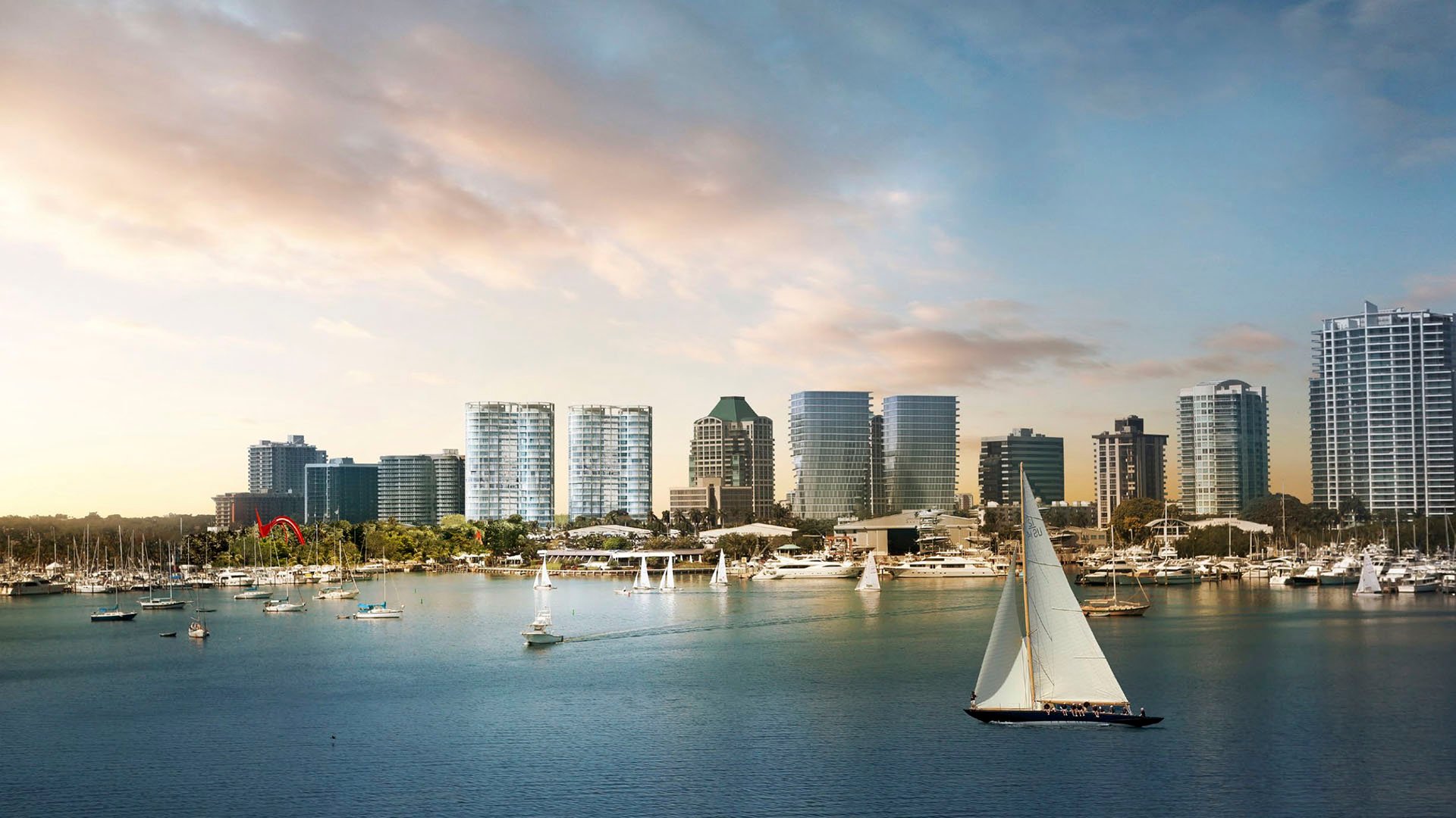 Waterfront skyline view with marinas, sailboats and a prominent sailboat in the foreground near Park Grove in Coconut Grove, framing the luxury and ultra luxury condos setting.