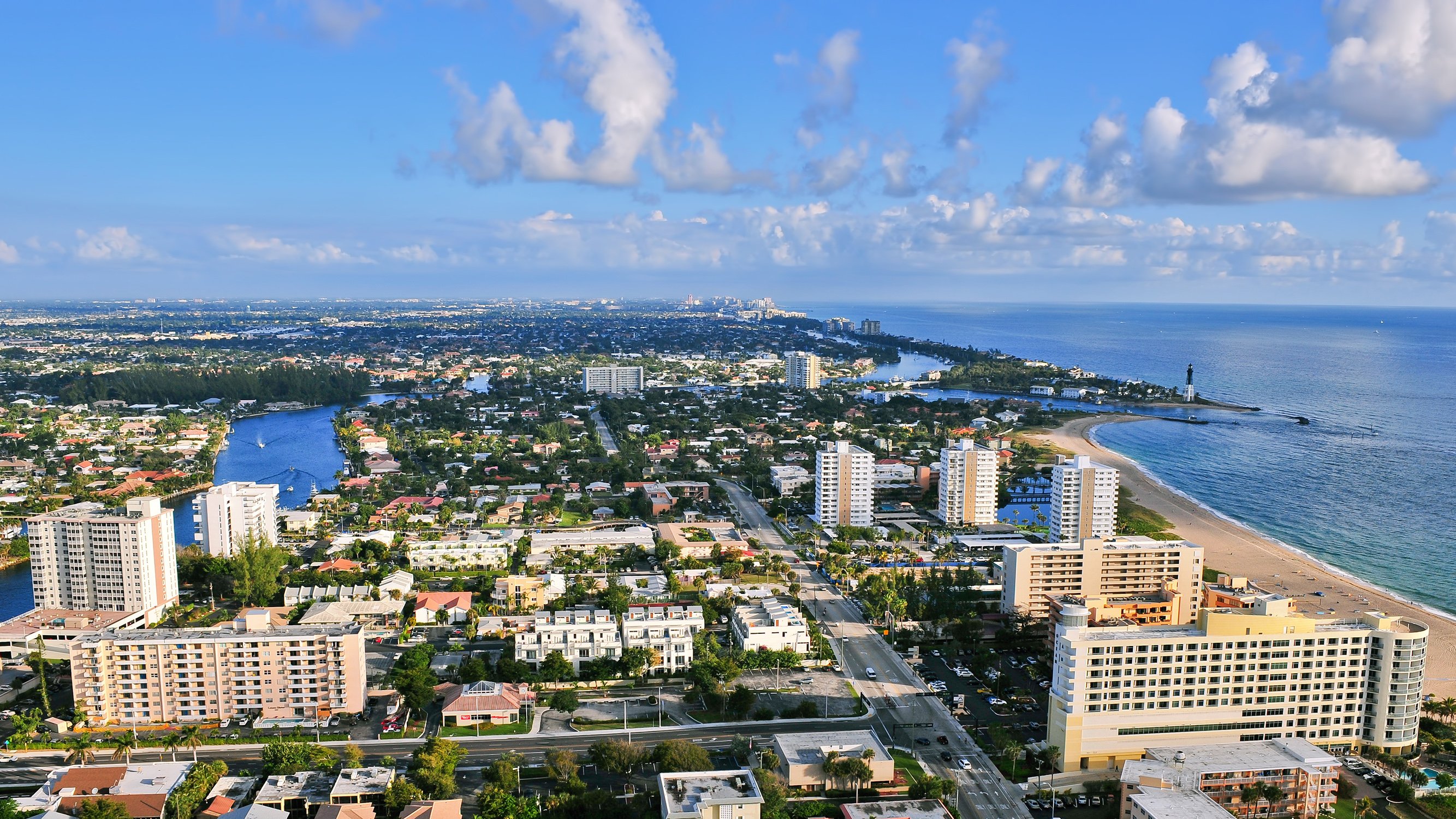Pompano Beach, Florida coastal cityscape with marinas and skyline, sought‑after location for luxury and ultra luxury condos; preconstruction and resale options.