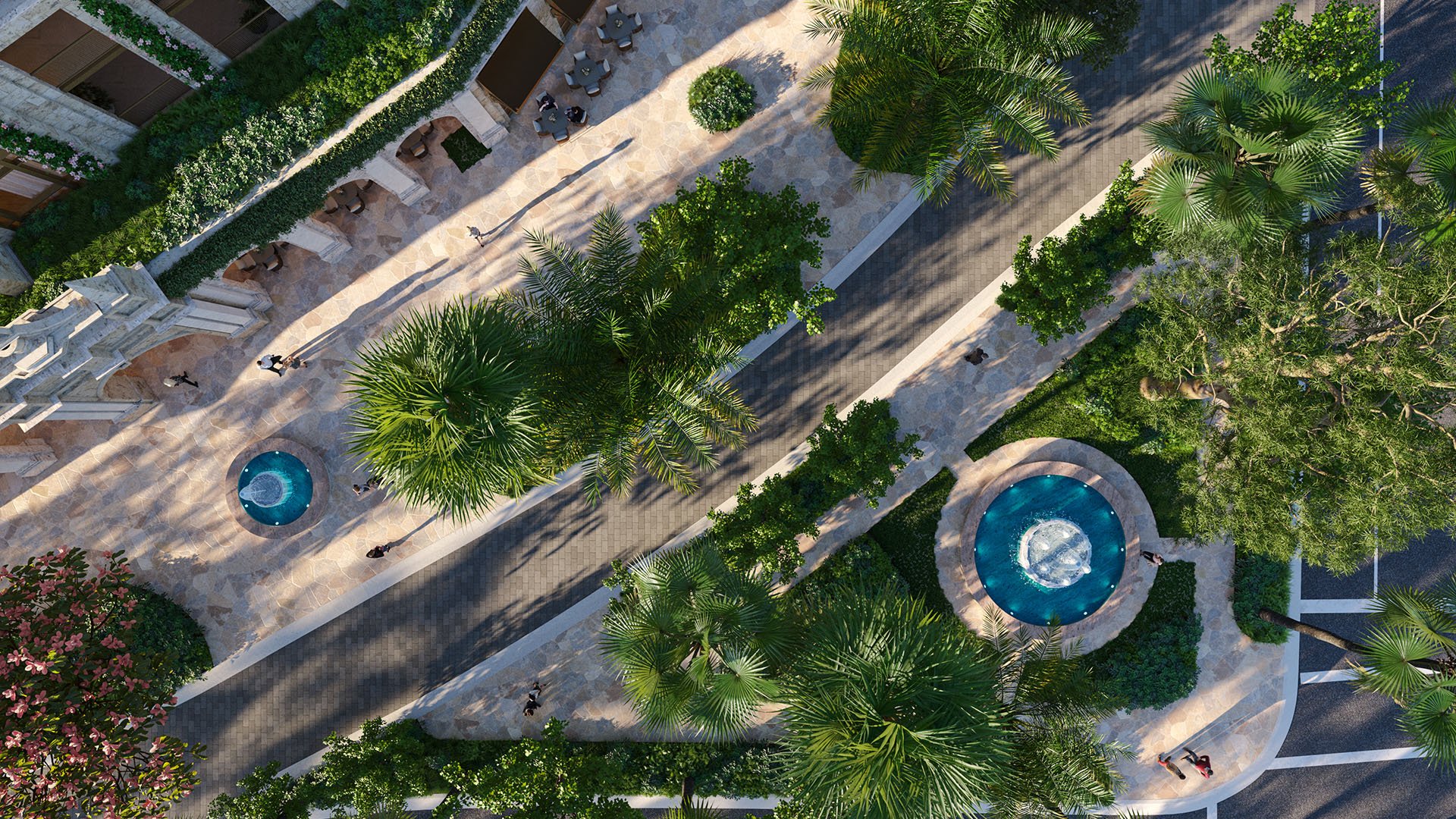 Top-down aerial of Ponce Park Residences entry paseo in Coral Gables, Miami with palm trees, stone walkways and fountains, representing luxury and ultra luxury preconstruction condos with resort-style arrival.