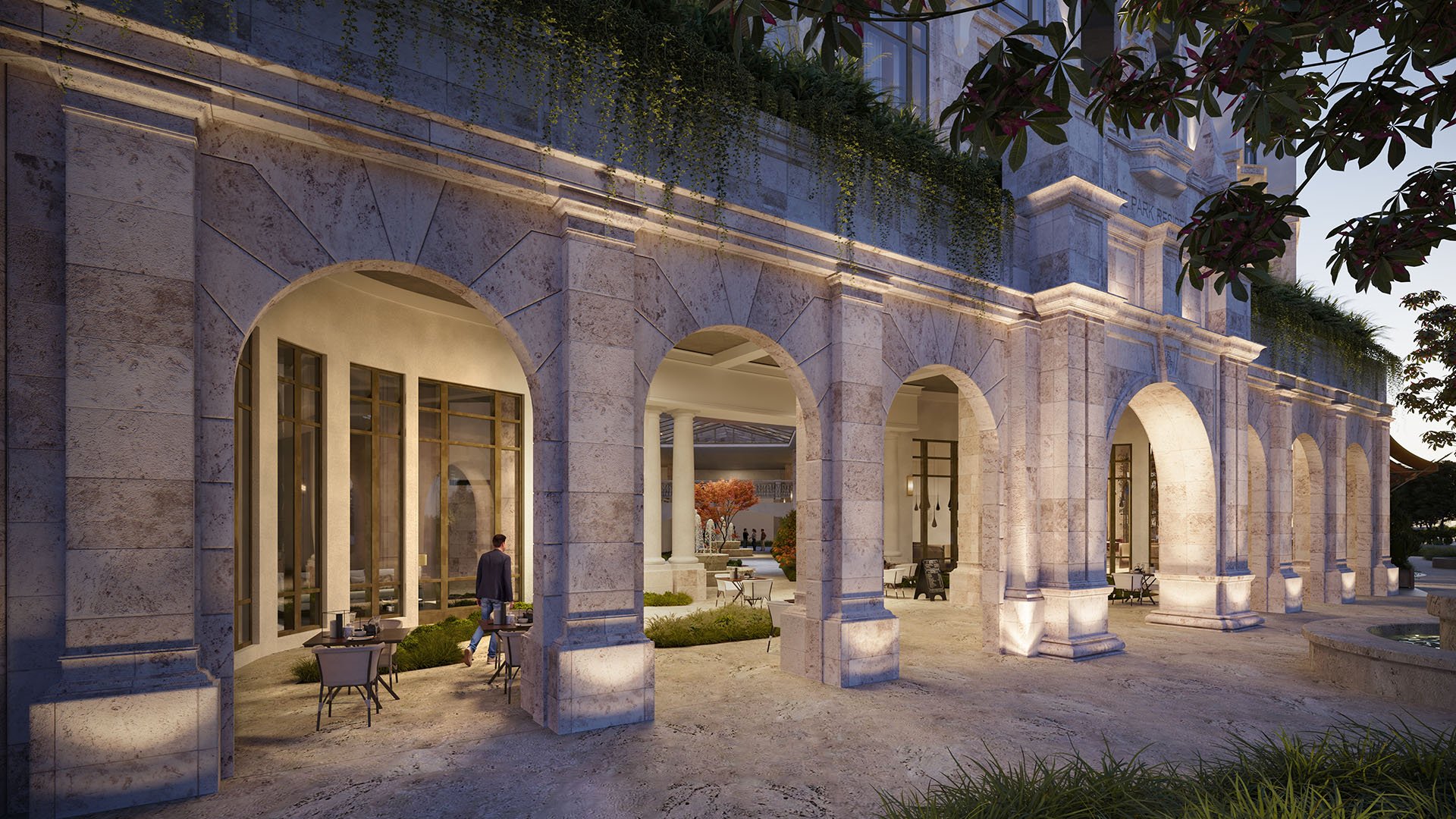 Ponce Park Residences Coral Gables, Miami stone-arch arcade at dusk with outdoor seating and colonnade views, highlighting luxury and ultra luxury preconstruction condos and boutique hospitality-inspired amenities.