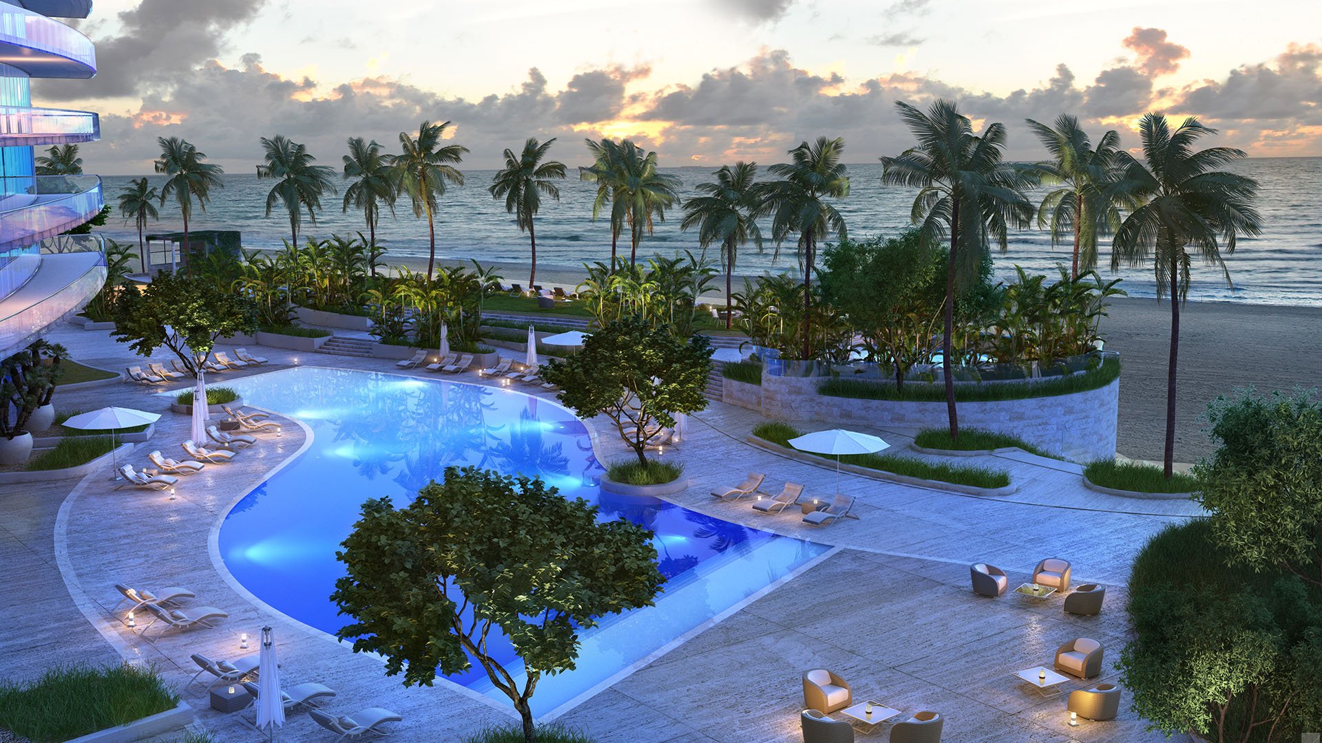 Residences by Armani Casa, Sunny Isles Beach luxury and ultra luxury preconstruction condos, aerial view of the curving pool deck with palms, lounge chairs, and the ocean just beyond.