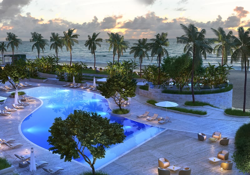 Residences by Armani Casa, Sunny Isles Beach luxury and ultra luxury preconstruction condos, aerial view of the curving pool deck with palms, lounge chairs, and the ocean just beyond.