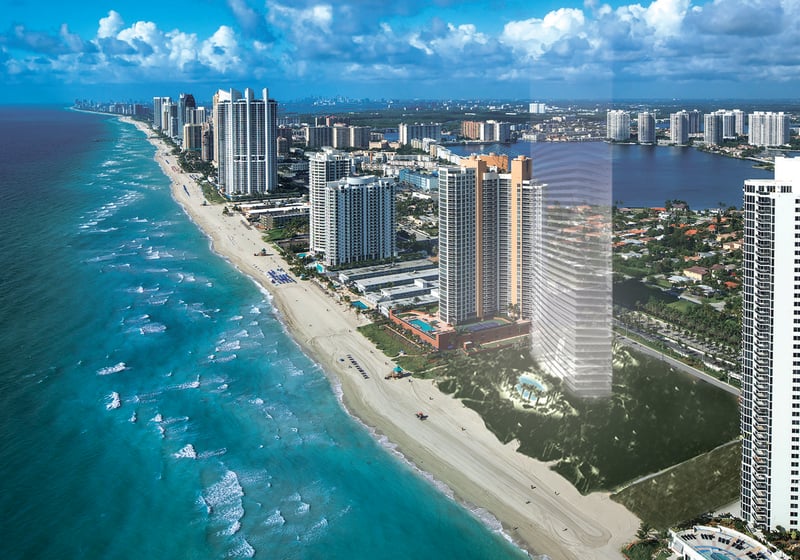 Residences by Armani Casa, Sunny Isles Beach luxury and ultra luxury preconstruction condos, aerial waterfront view of the beachfront tower along turquoise shoreline and the surrounding skyline.