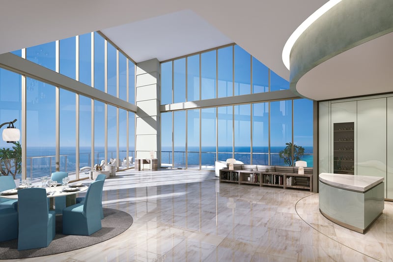 Residences by Armani Casa, Sunny Isles Beach luxury and ultra luxury preconstruction condos, double-height chef kitchen and dining room with glossy floors, curved cabinetry, and wide ocean views.