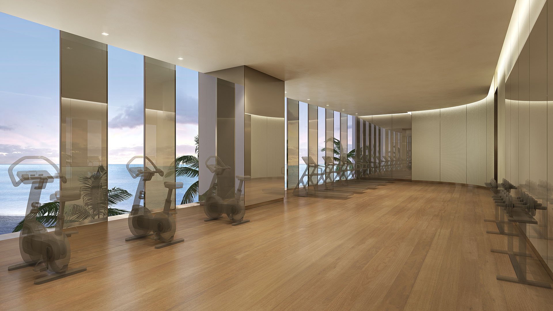 Residences by Armani Casa, Sunny Isles Beach luxury and ultra luxury preconstruction condos, ocean-view fitness center with cardio equipment, wood floors, and a long window-lined workout space.
