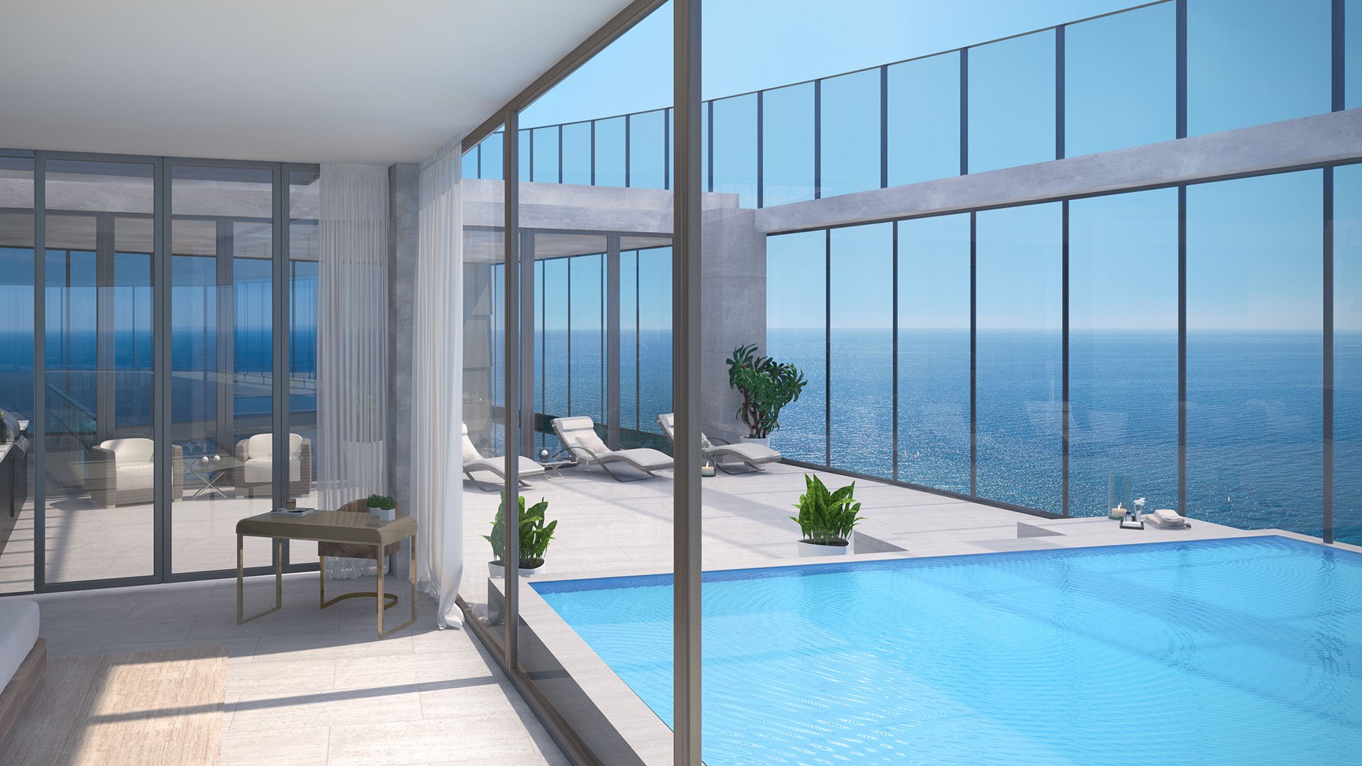 Residences by Armani Casa, Sunny Isles Beach luxury and ultra luxury preconstruction condos, indoor pool terrace with full-height glass, sun loungers, and open ocean views.
