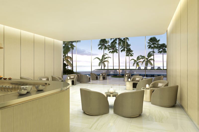 Residences by Armani Casa, Sunny Isles Beach luxury and ultra luxury preconstruction condos, lobby bar lounge with a curved bar, upholstered seating, and palm-filled views beyond the glass.