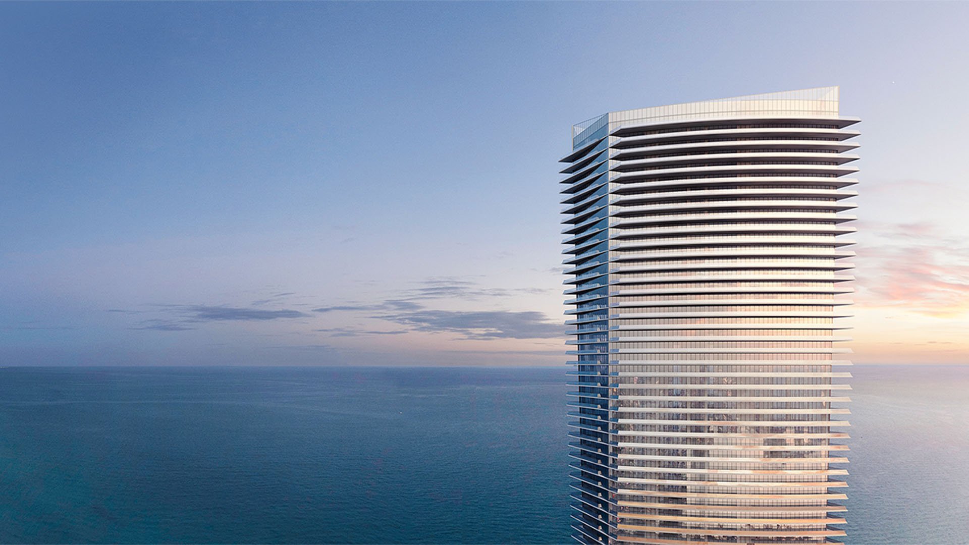 Residences by Armani Casa, Sunny Isles Beach luxury and ultra luxury preconstruction condos, waterfront tower exterior at sunset with sweeping horizontal balconies above the ocean.