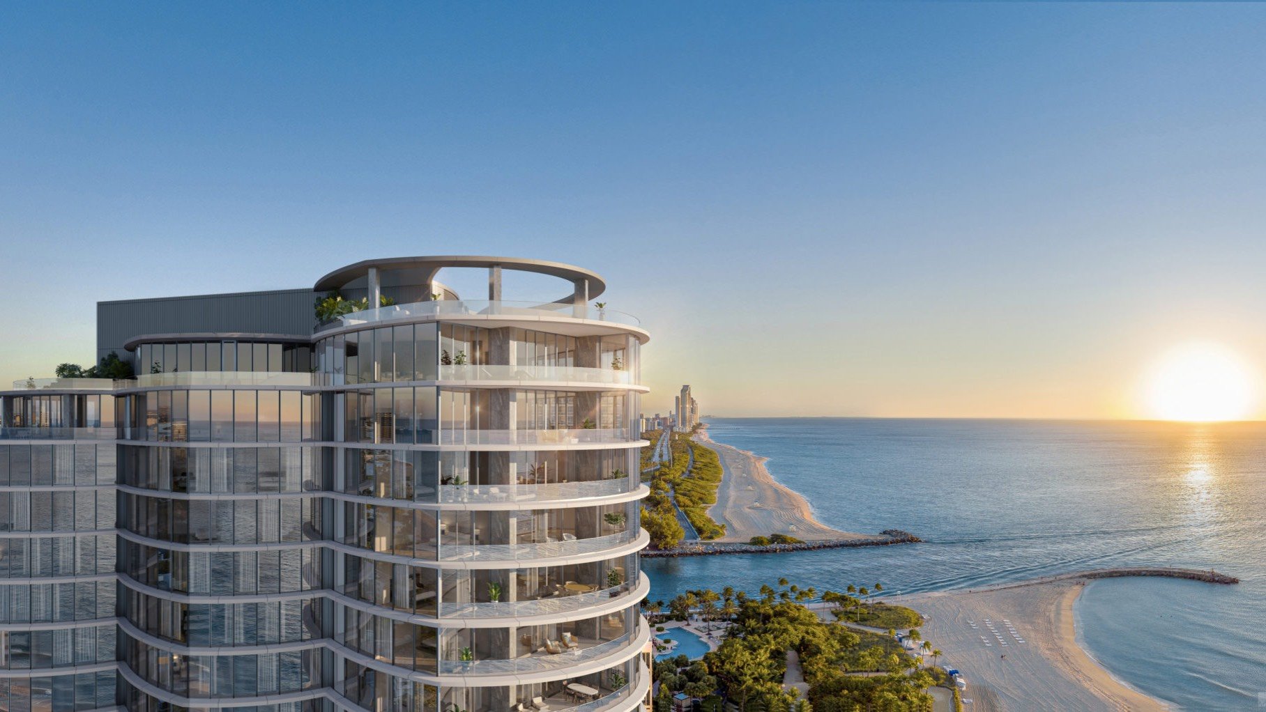 Rivage Bal Harbour modern oceanfront condo at sunset, glass façade over the Atlantic in Bal Harbour, Miami, boutique luxury and ultra luxury condos; preconstruction. Featuring coastal view.