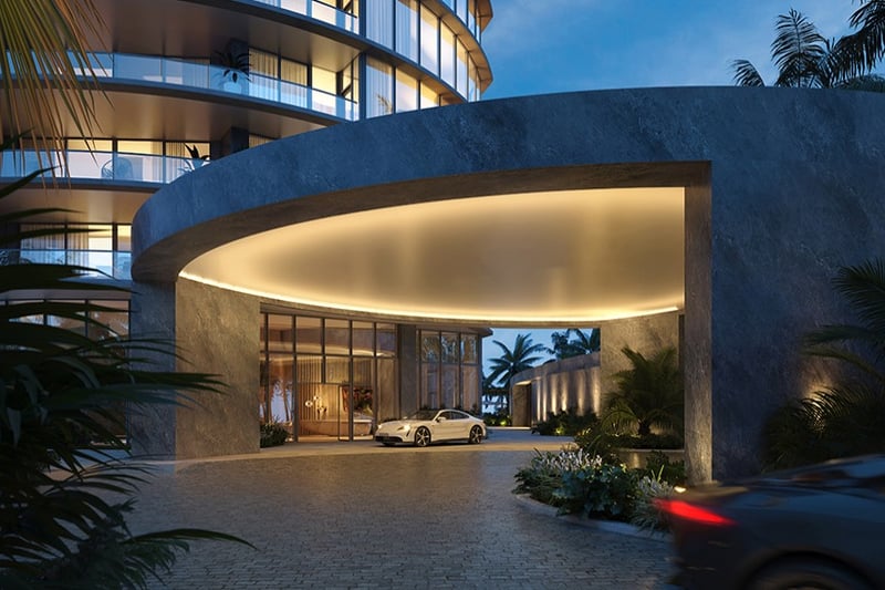 Rivage Bal Harbour luxury apartment entrance at night, porte‑cochère glow in Bal Harbour, Miami, arrival for luxury and ultra luxury condos; preconstruction.