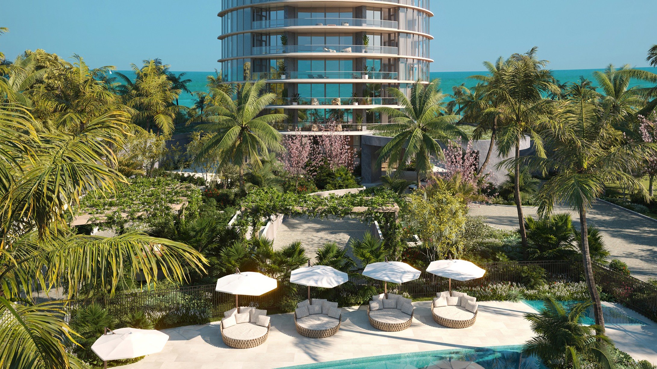 Rivage Bal Harbour coastal resort garden view with palms in Bal Harbour, Miami, resort‑style grounds for luxury and ultra luxury condos; preconstruction.