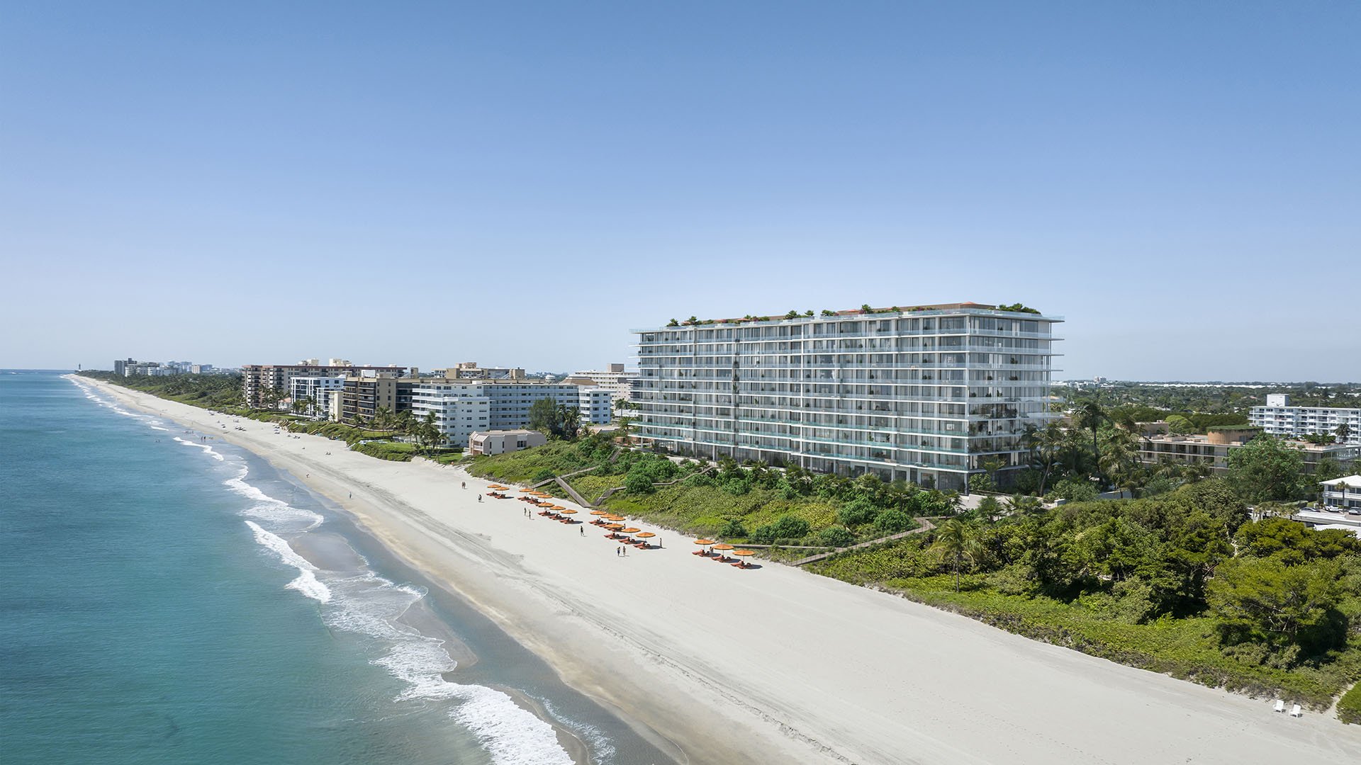 South aerial coastline view of Rosewood Residences Hillsboro Beach, Florida above the Atlantic Ocean and sandy beach, representing luxury and ultra luxury preconstruction condos.