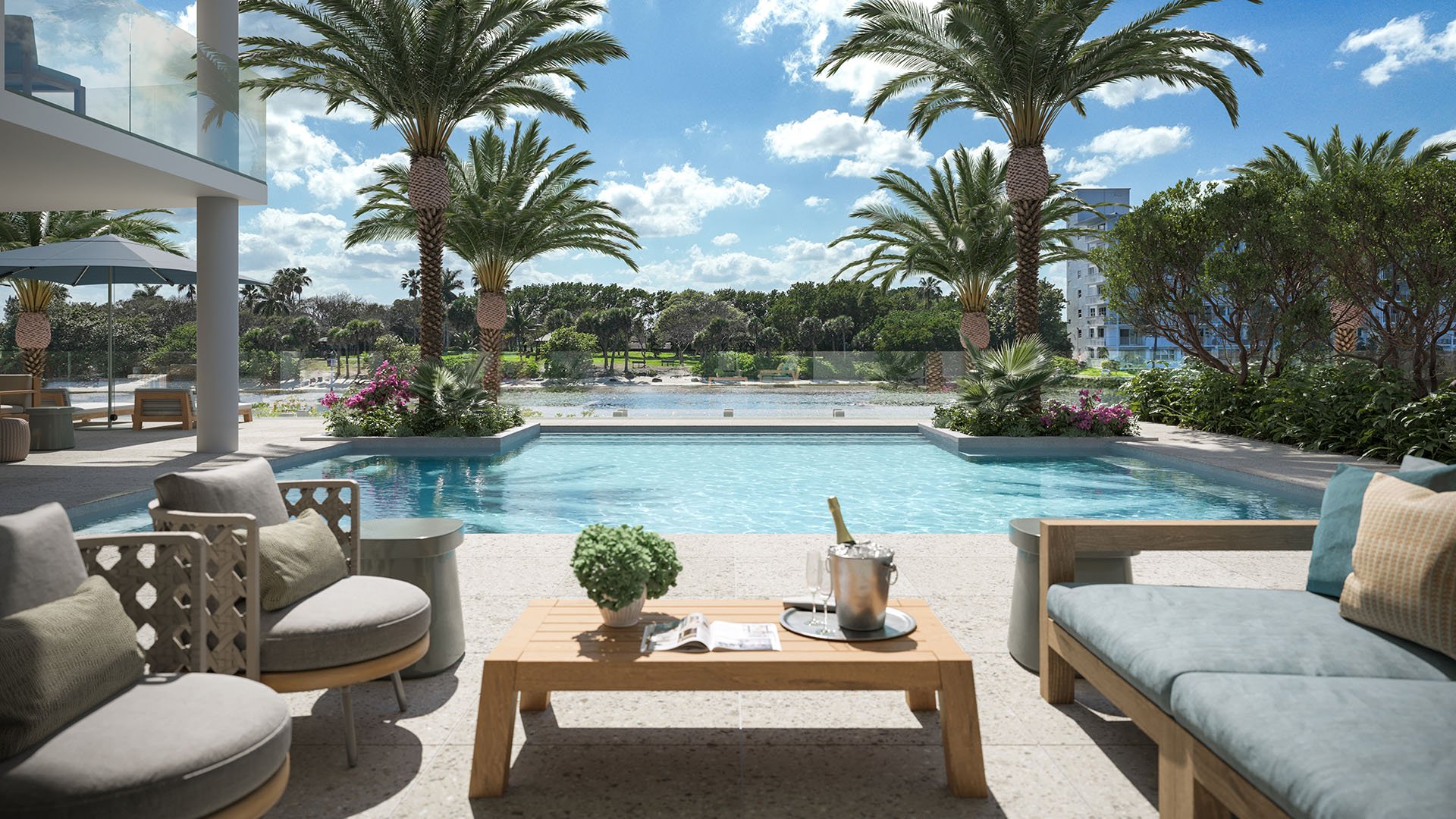 Intracoastal pool deck at Rosewood Residences Hillsboro Beach, Florida, palm-lined pool and lounge seating overlooking the Intracoastal Waterway, luxury and ultra luxury preconstruction condos amenities.