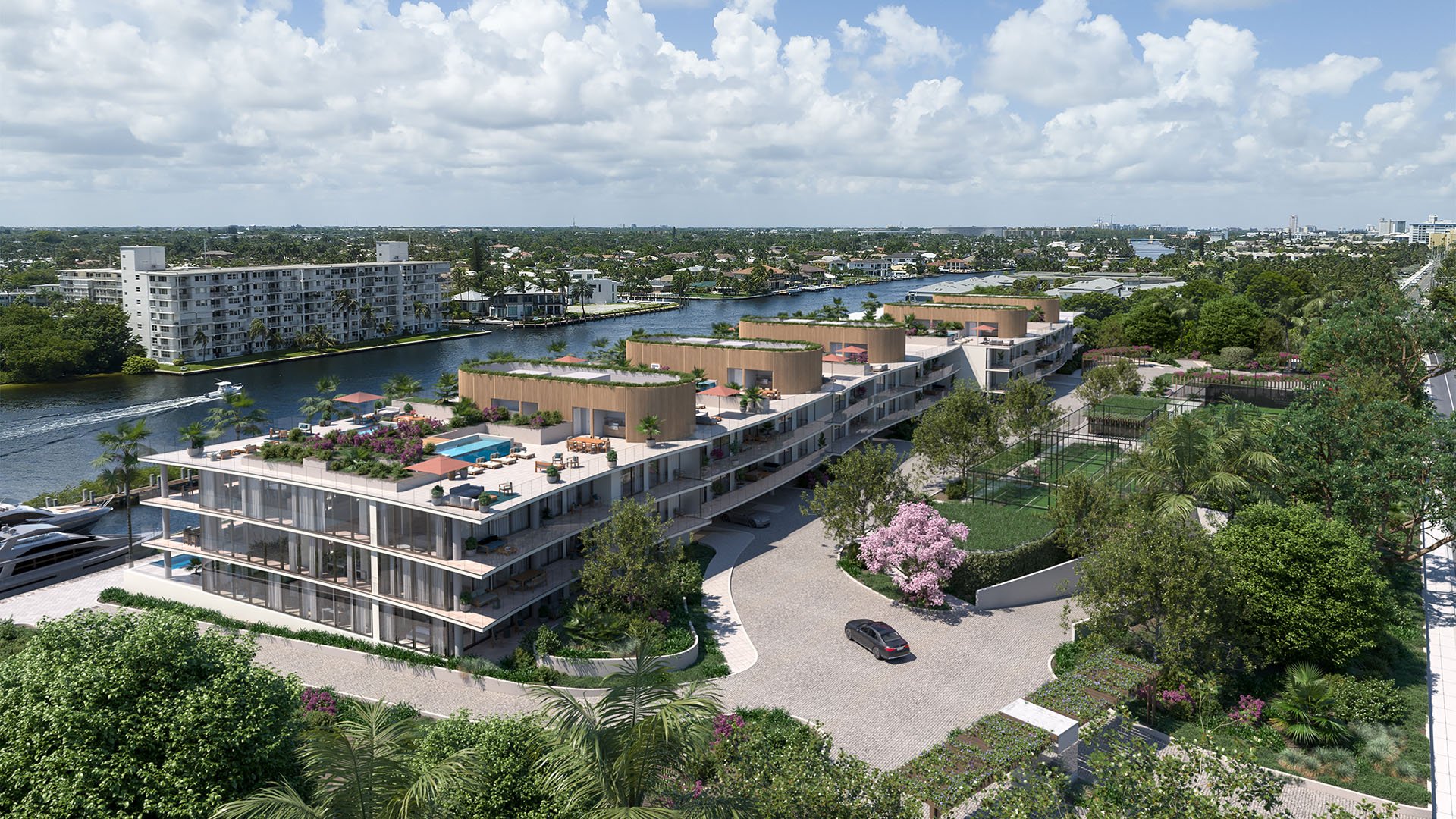 Aerial of Rosewood Residences Hillsboro Beach, Florida intracoastal waterfront residences with rooftop pools, marina frontage and tennis courts, showcasing luxury and ultra luxury preconstruction condos.