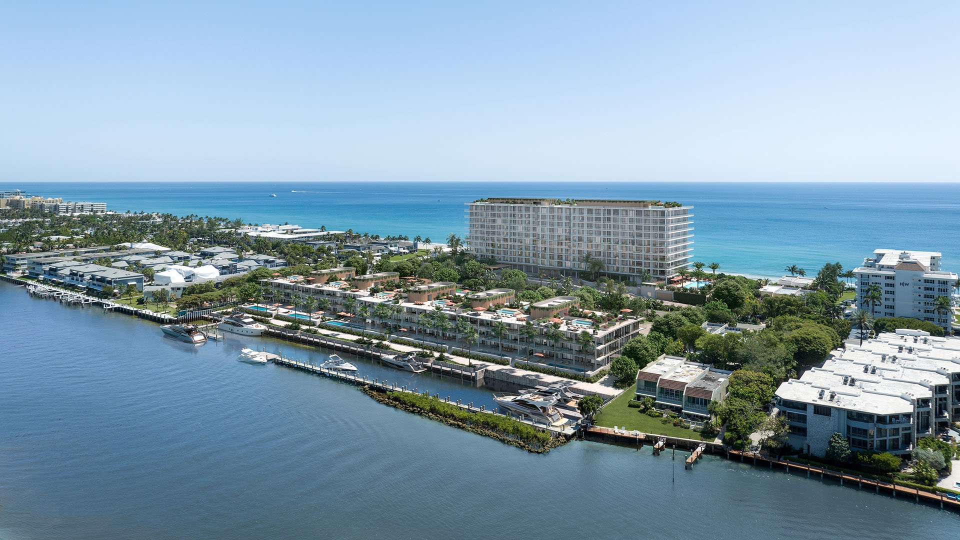 Aerial hero of Rosewood Residences Hillsboro Beach, Florida on the Intracoastal Waterway with private marina docks and yachts, Atlantic Ocean backdrop, highlighting luxury and ultra luxury preconstruction condos.