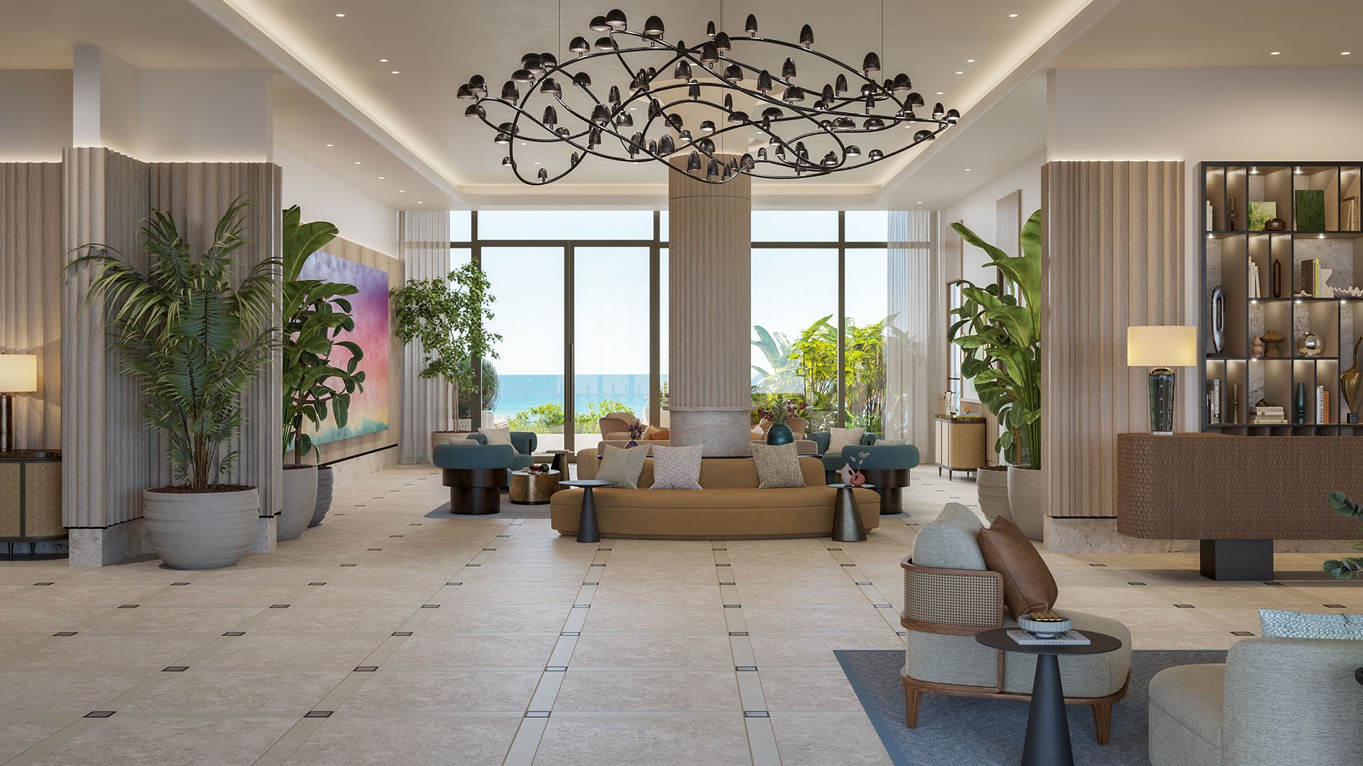 Lobby lounge at Rosewood Residences Hillsboro Beach, Florida with sculptural chandelier, designer seating and Atlantic Ocean view, defining luxury and ultra luxury preconstruction condos lifestyle.