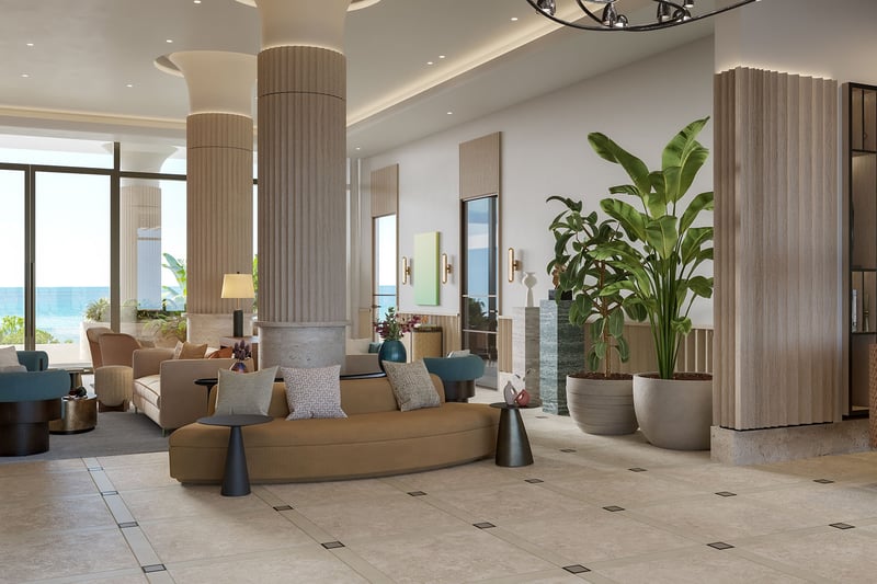 Rosewood Residences Hillsboro Beach, Florida lobby lounge with tall columns, indoor plants and ocean-view seating area, part of luxury and ultra luxury preconstruction condos amenities.
