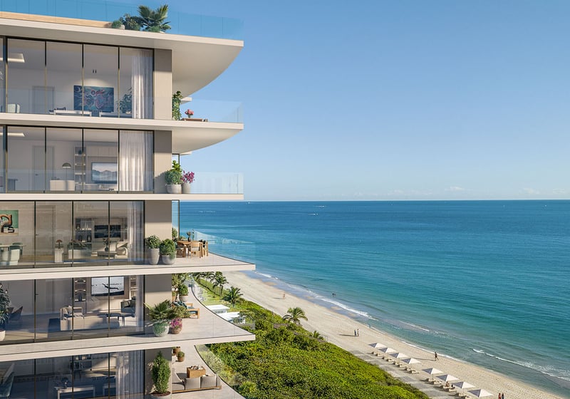 Oceanfront corner residence balcony at Rosewood Residences Hillsboro Beach, Florida with wraparound terrace and floor-to-ceiling glass overlooking the Atlantic Ocean, luxury and ultra luxury preconstruction condos.