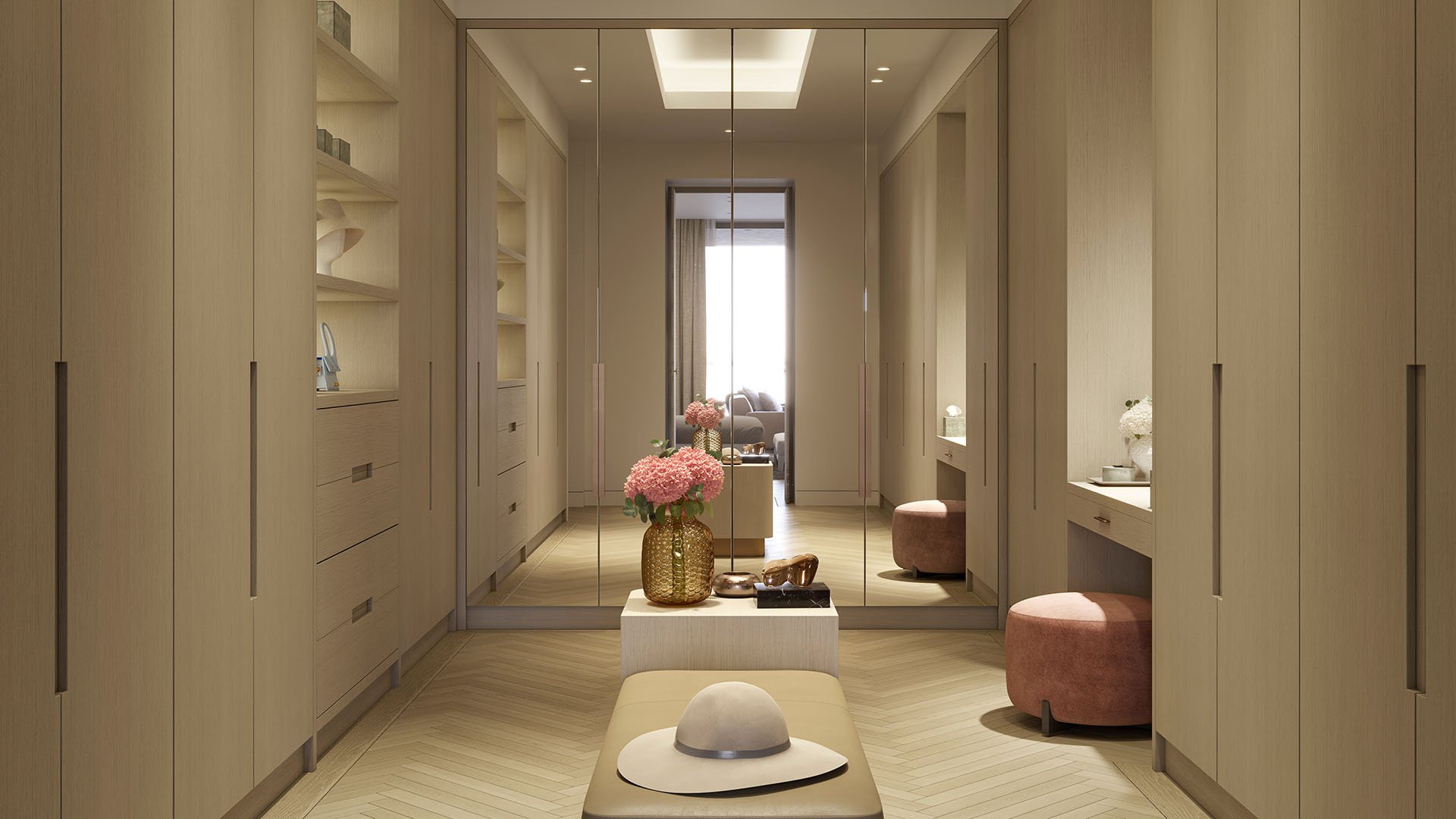Rosewood Residences Hillsboro Beach, Florida walk-in closet dressing room with custom wardrobes, mirrored doors, drawers and plush seating ottomans, designed for luxury and ultra luxury preconstruction condos.