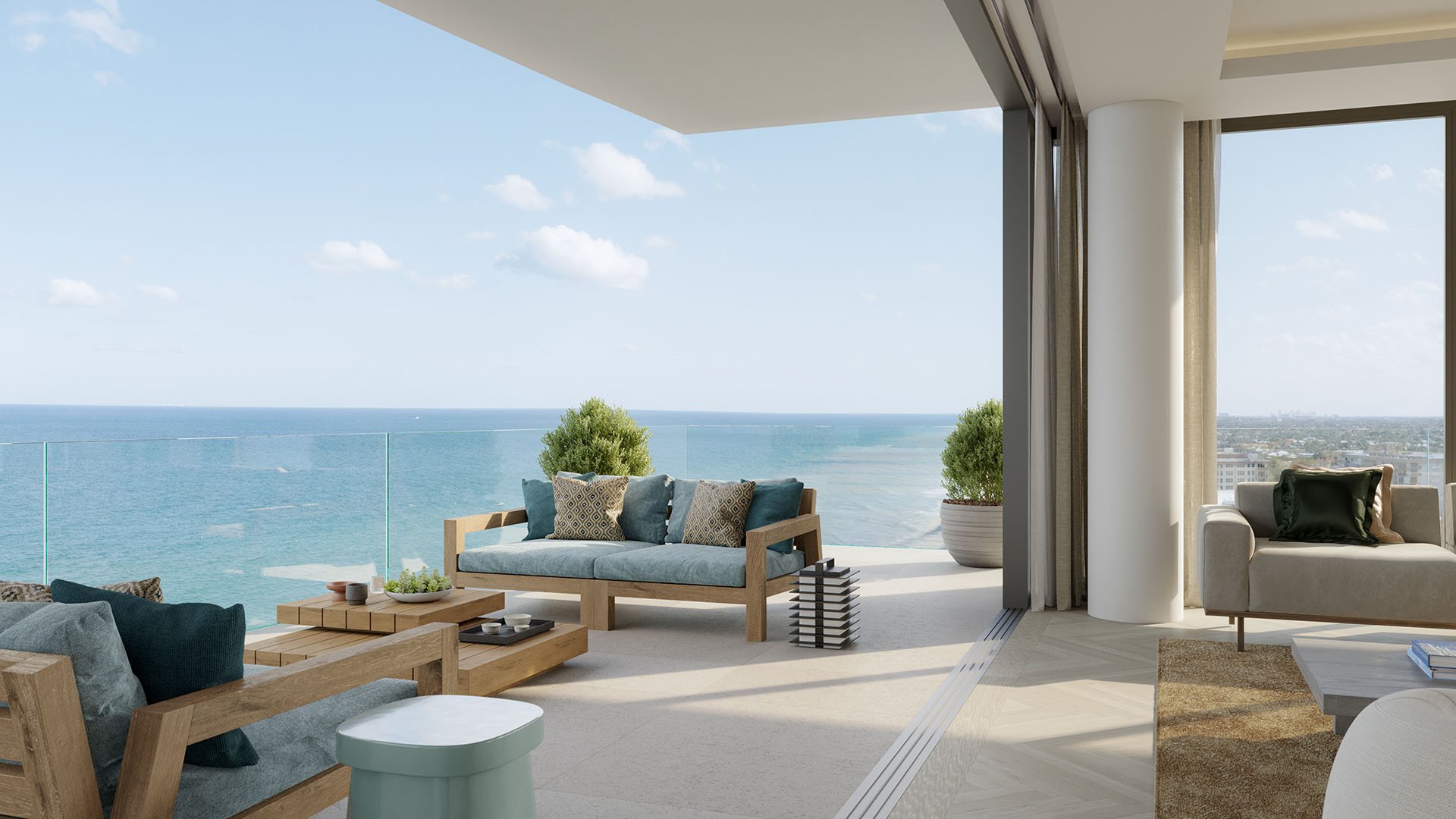 Rosewood Residences Hillsboro Beach, Florida private oceanfront terrace with outdoor sofa, indoor-outdoor living and glass railing overlooking the Atlantic, for luxury and ultra luxury preconstruction condos.