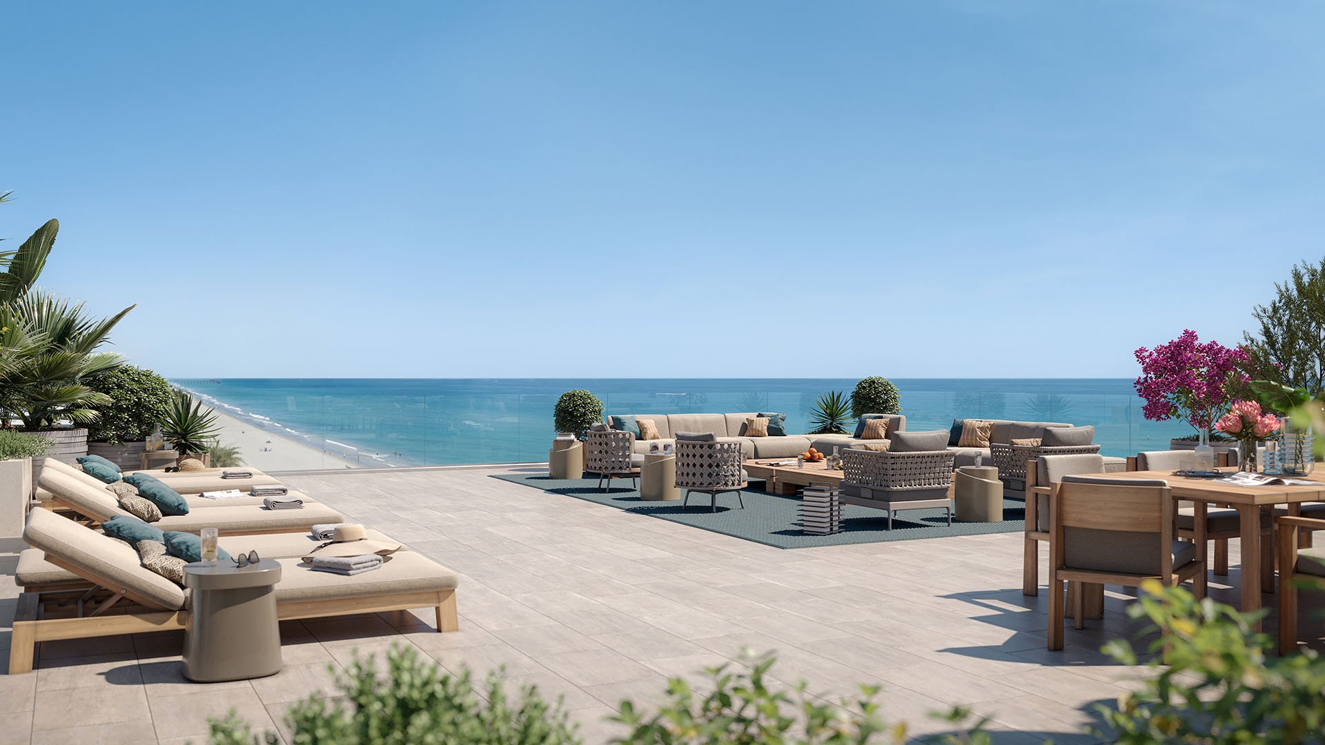 Rosewood Residences Hillsboro Beach, Florida rooftop ocean-view terrace with sun loungers, outdoor living room and dining beside glass railing, amenities for luxury and ultra luxury preconstruction condos.
