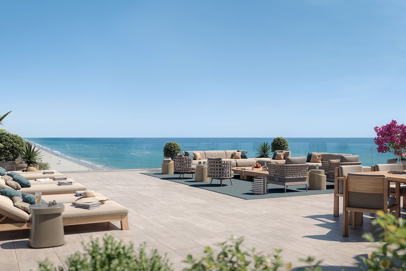 Rosewood Residences Hillsboro Beach, Florida rooftop ocean-view terrace with sun loungers, outdoor living room and dining beside glass railing, amenities for luxury and ultra luxury preconstruction condos.