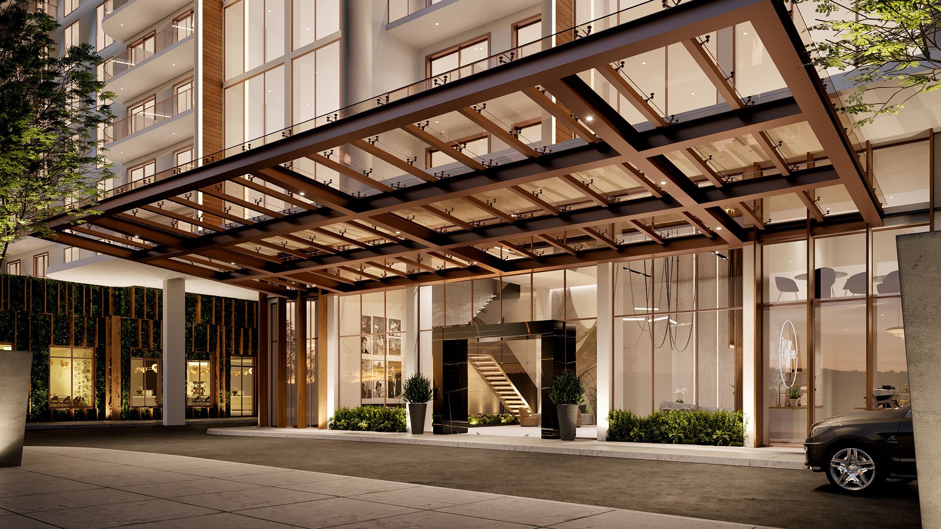 Shoma Bay arrival porte cochere with glass canopy and modern lobby entrance in North Bay Village, Miami, Florida, highlighting luxury and ultra luxury preconstruction condos with resort-style curb appeal.