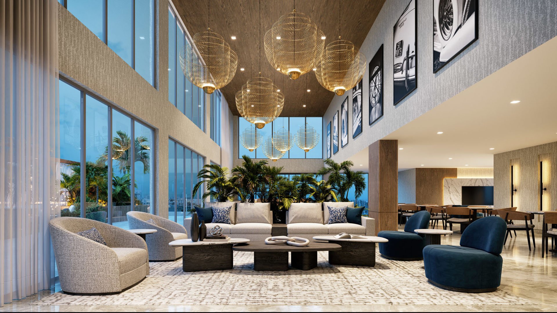 Double-height lounge seating with basket pendant lights, floor-to-ceiling glass and dining area at Shoma Bay, North Bay Village, Miami, Florida, featuring luxury and ultra luxury preconstruction condos social spaces.