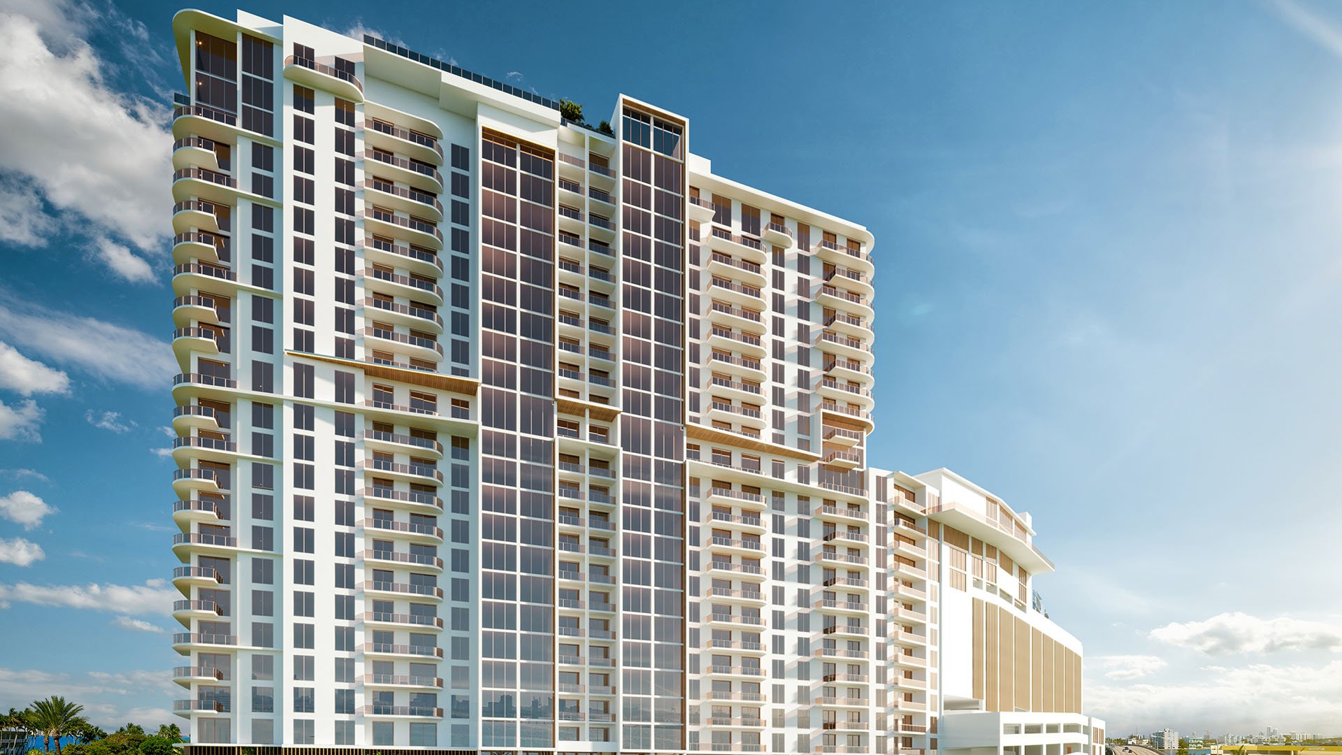 Close-up daytime view of Shoma Bay high-rise facade in North Bay Village, Miami, Florida, showcasing luxury and ultra luxury preconstruction condos with curved balconies, glass towers and contemporary design.