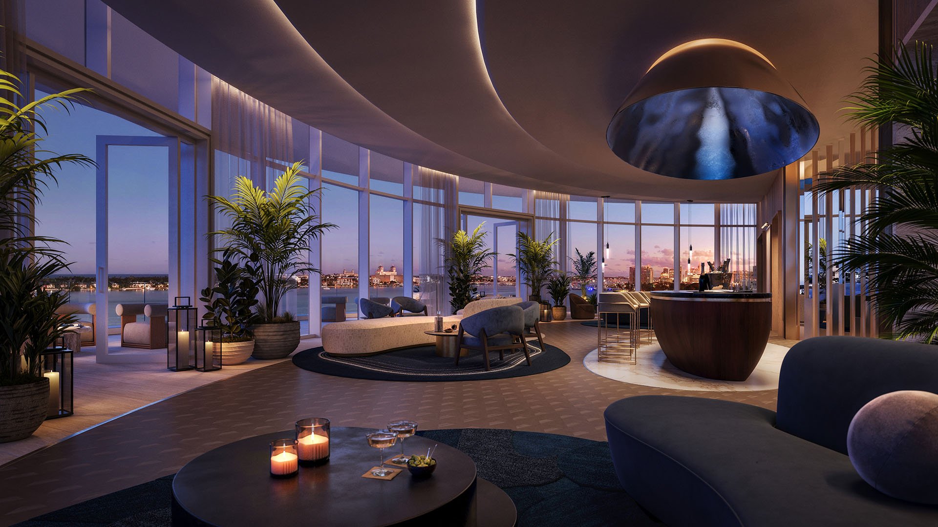 Shorecrest Flagler Drive event lounge and bar in West Palm Beach, Florida, featuring floor-to-ceiling windows and panoramic waterfront sunset views - luxury, ultra luxury preconstruction condos entertaining amenity.