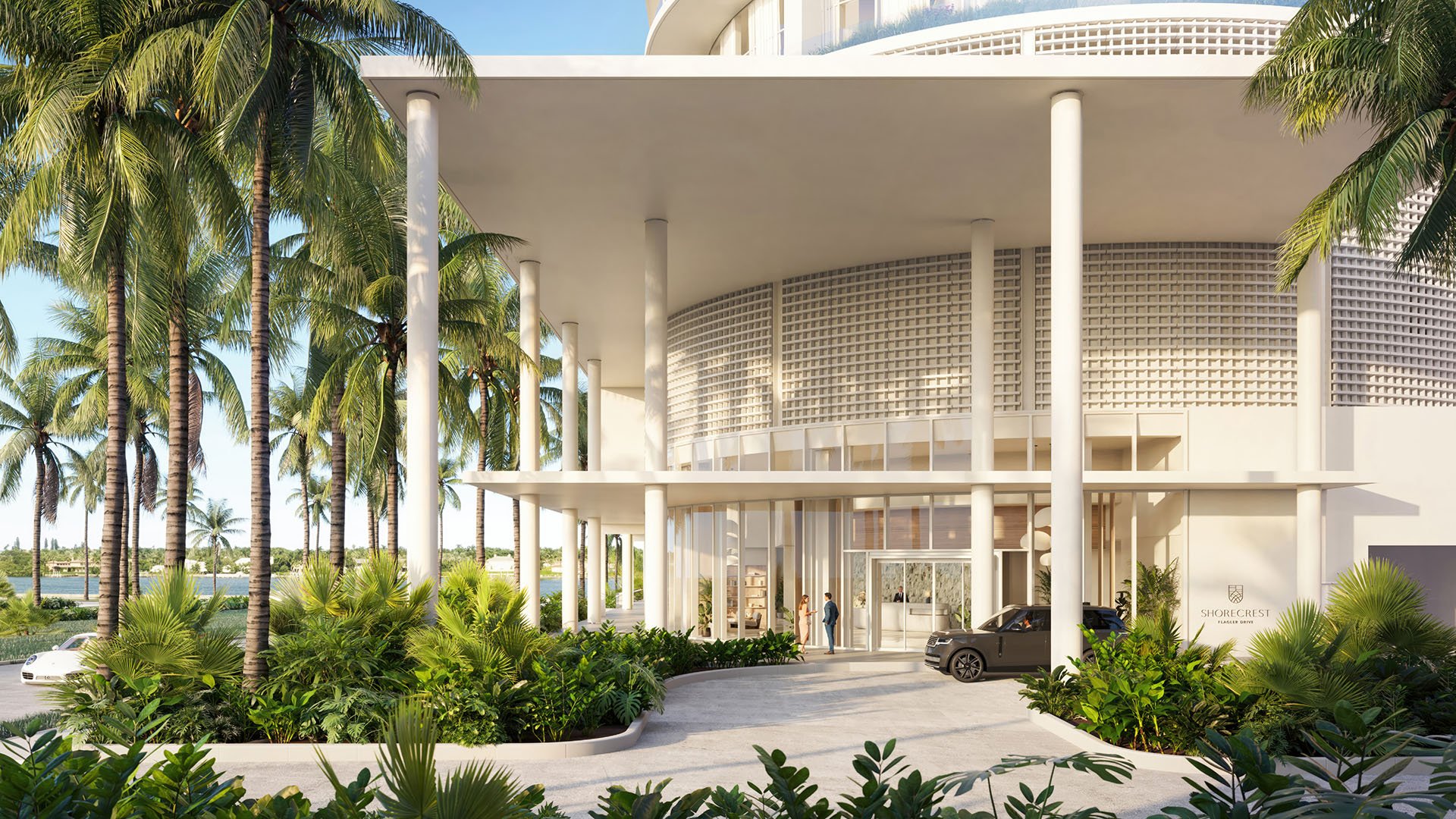 Shorecrest Flagler Drive grand porte cochere entrance on Flagler Drive, West Palm Beach, Florida, with covered drop-off, modern facade and palm landscaping - luxury, ultra luxury preconstruction condos arrival.