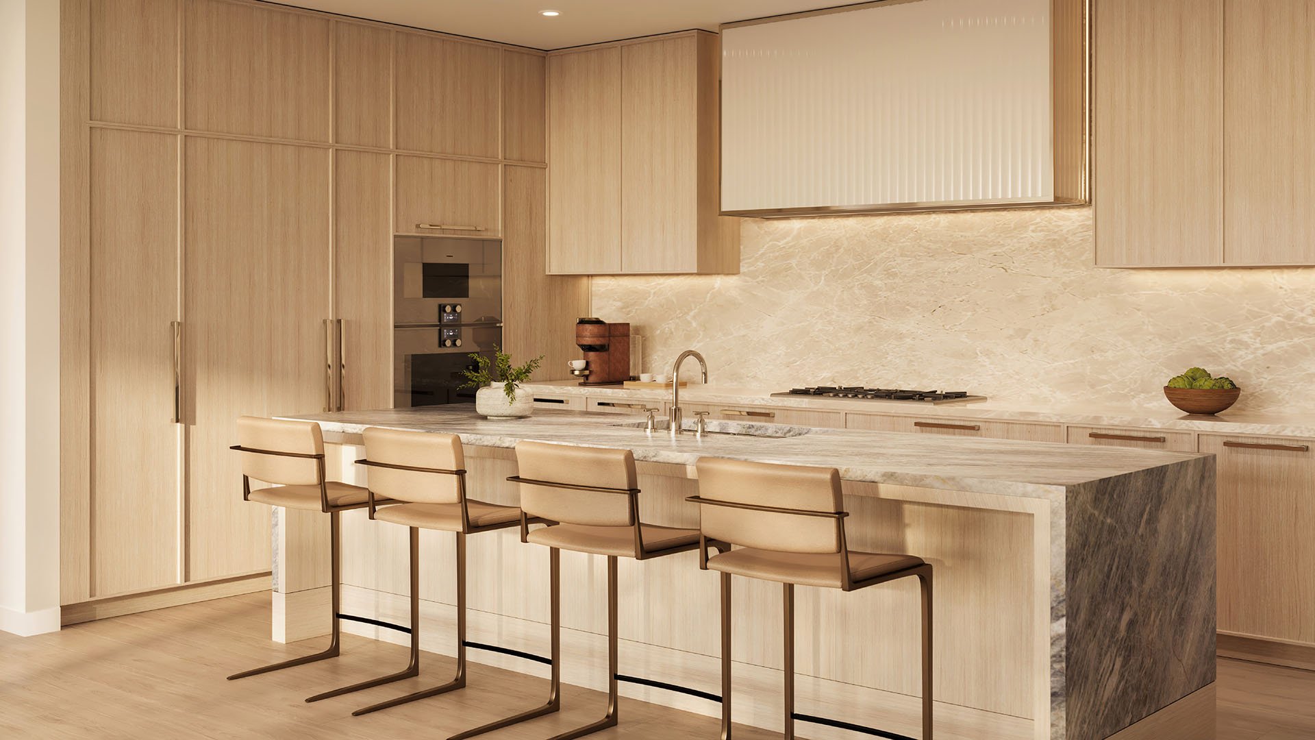 Shorecrest Flagler Drive luxury kitchen in West Palm Beach, Florida, with custom cabinetry, marble waterfall island and bar stools - ultra luxury preconstruction condos with high-end finishes.