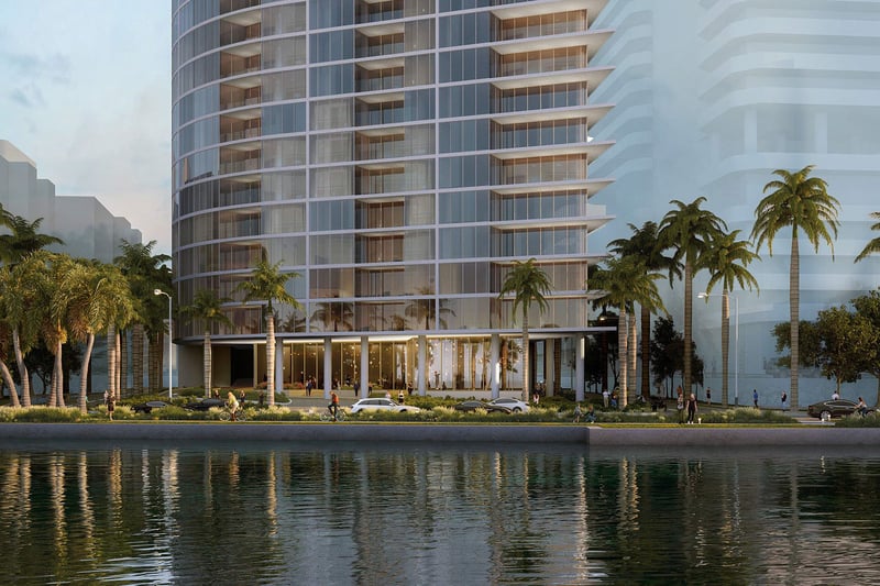 Shorecrest Flagler Drive, West Palm Beach, Florida waterfront residential tower exterior with palm-lined promenade, representing luxury and ultra luxury preconstruction condos on the Intracoastal Waterway.