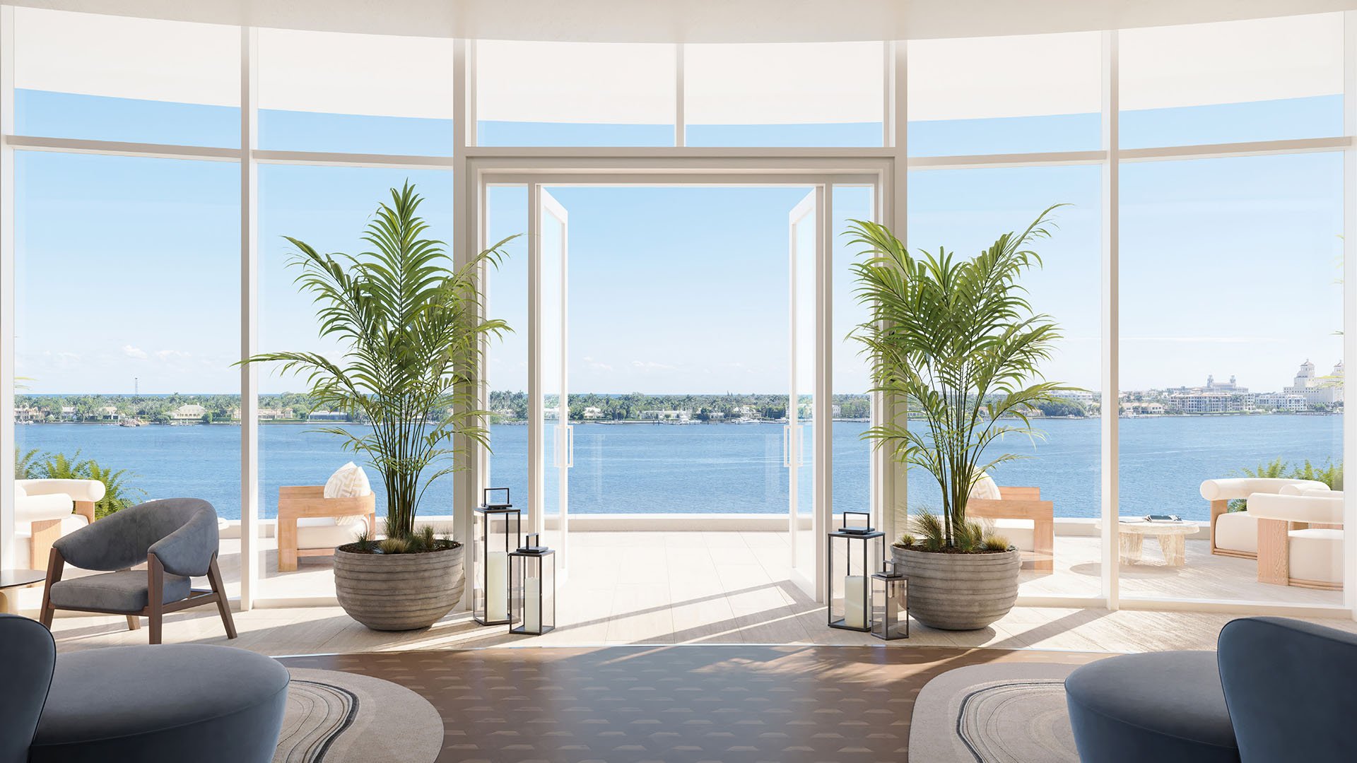 Shorecrest on Flagler Drive, West Palm Beach, Florida waterfront resident lounge terrace with floor-to-ceiling windows, potted palms and seating, showcasing luxury and ultra luxury preconstruction condos.