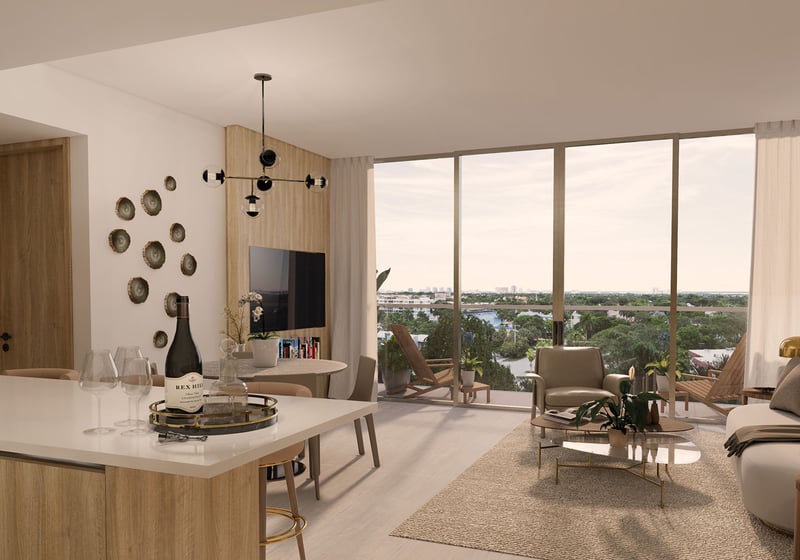 Sixth & Rio luxury and ultra luxury preconstruction condos in Fort Lauderdale, Florida, open living room and kitchen with island and floor-to-ceiling sliding glass doors to balcony with city and water views.