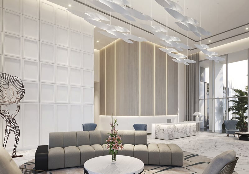 Sixth & Rio luxury and ultra luxury preconstruction condos in Fort Lauderdale, Florida, modern lobby with marble flooring, reception desk, sculptural chandelier and lounge seating.