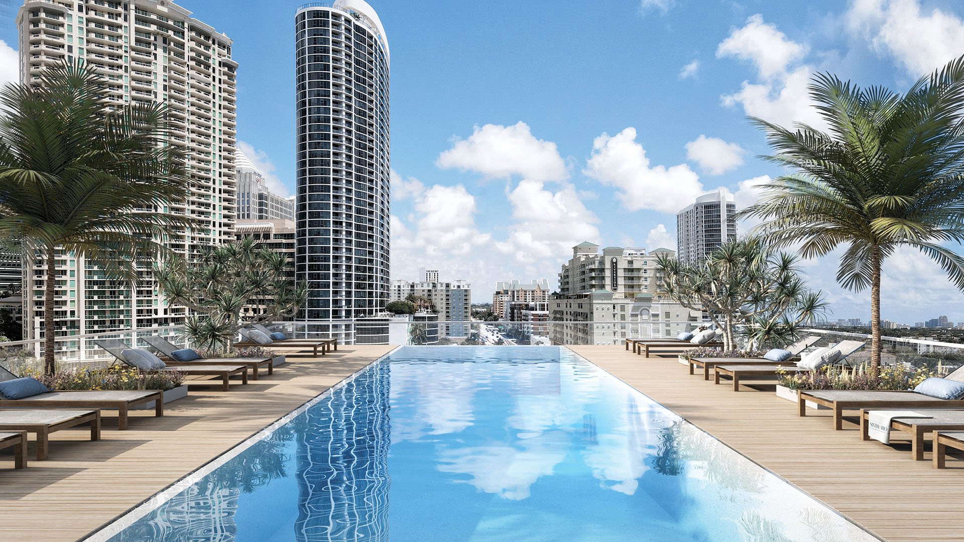 Sixth & Rio luxury and ultra luxury preconstruction condos in Fort Lauderdale, Florida, rooftop infinity pool with city skyline views, sun loungers and palm trees.