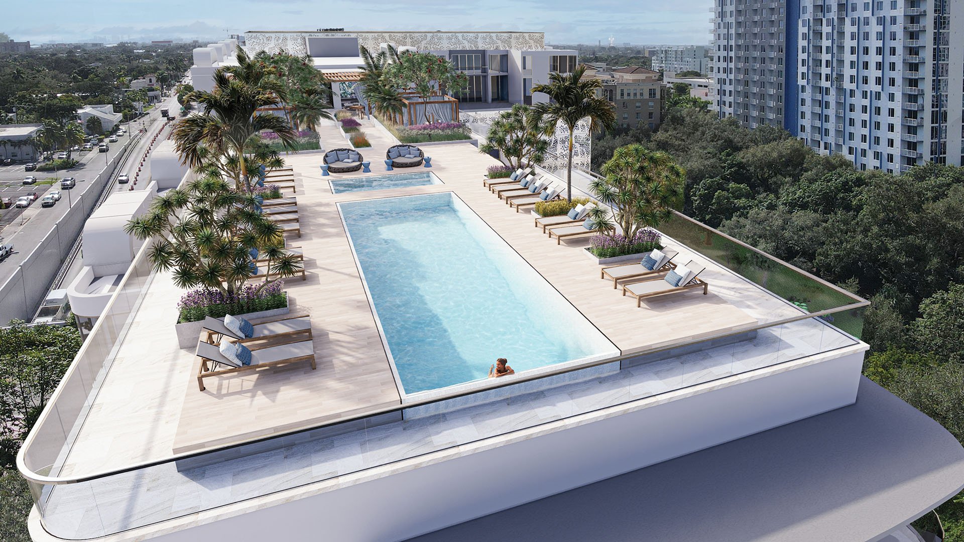 Sixth & Rio luxury and ultra luxury preconstruction condos in Fort Lauderdale, Florida, aerial rooftop lap pool and sun deck with loungers, cabanas, palms and resort-style landscaping.