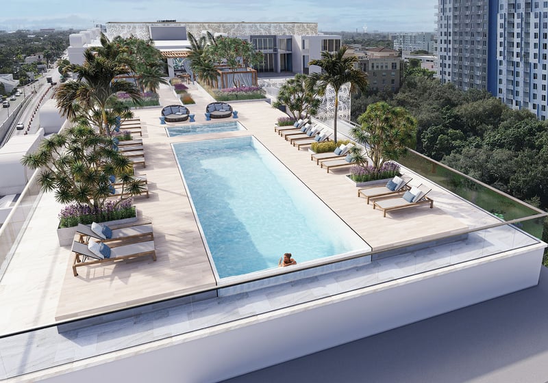 Sixth & Rio luxury and ultra luxury preconstruction condos in Fort Lauderdale, Florida, aerial rooftop lap pool and sun deck with loungers, cabanas, palms and resort-style landscaping.