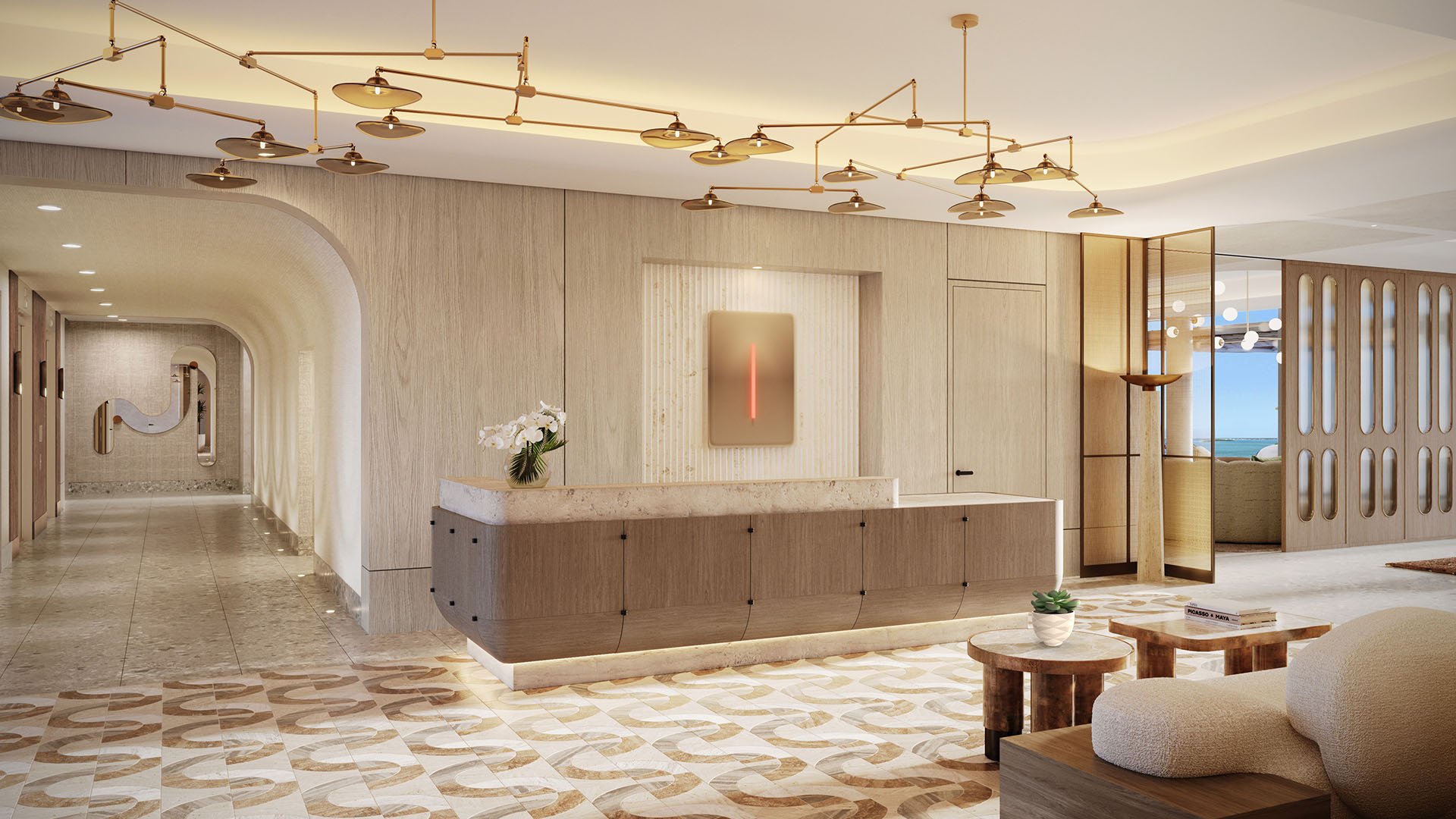 Solana Bay North Miami Beach, Florida arrival lobby with concierge reception desk, sculptural lighting and modern corridor, representing luxury and ultra luxury preconstruction condos.