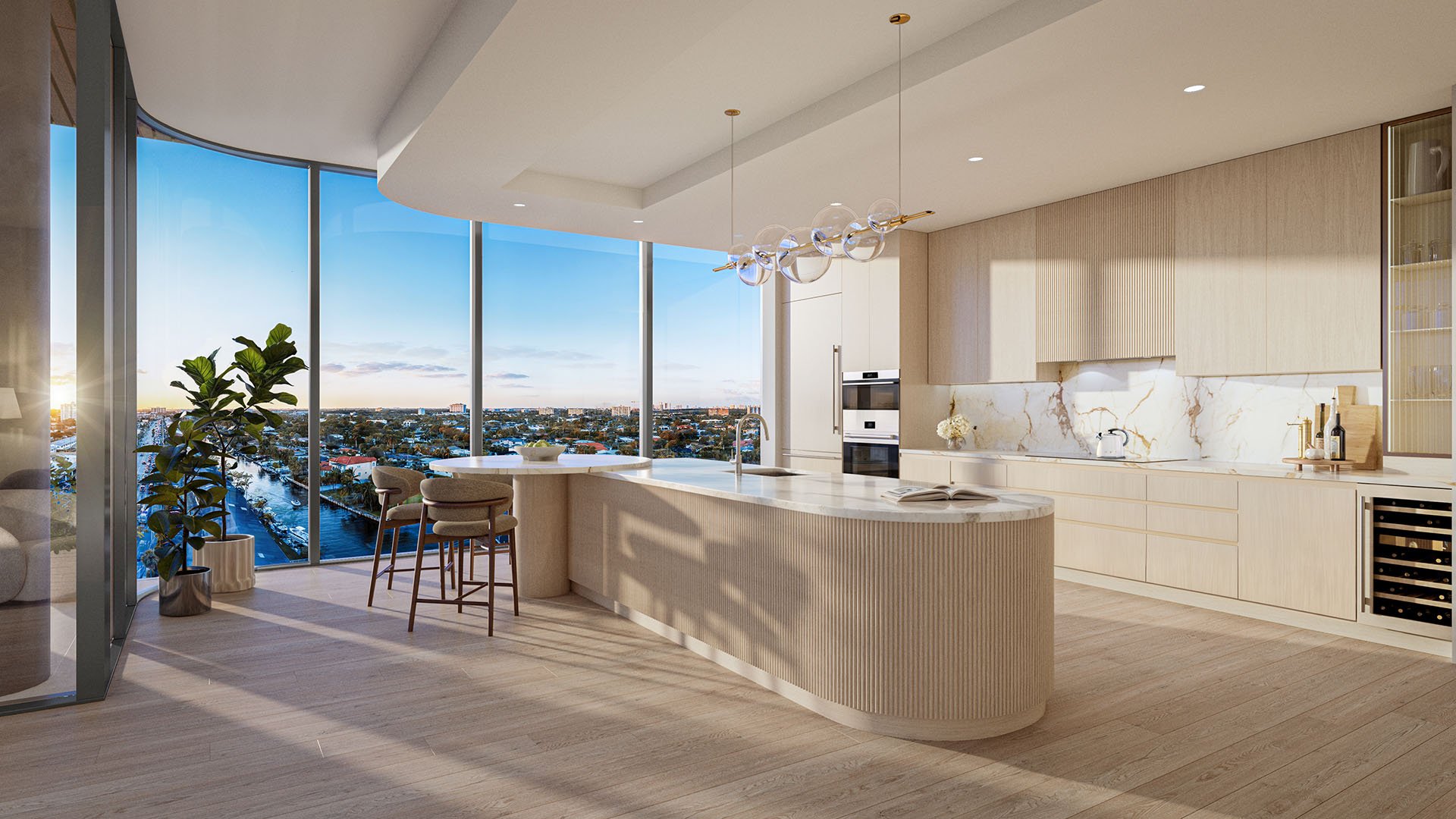 Solana Bay North Miami Beach, Florida Residence F kitchen with oversized island, breakfast bar, modern appliances and floor-to-ceiling windows with city and bay views, featuring luxury and ultra luxury preconstruction condos.