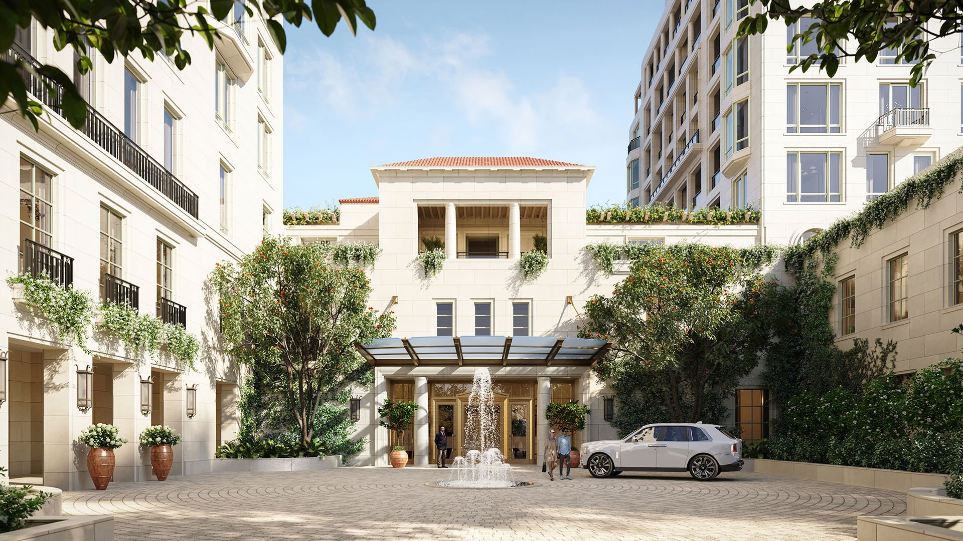 Grand arrival motor court with a central fountain and porte cochere at South Flagler House in West Palm Beach, introducing luxury and ultra luxury condos with elegant landscaping and architecture.