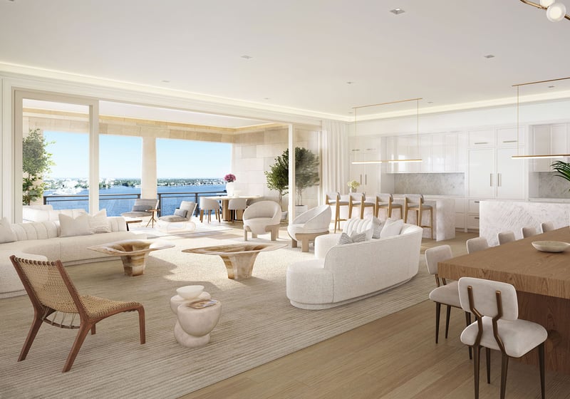 Open great room with kitchen, dining and waterfront seating areas at South Flagler House in West Palm Beach, presenting luxury and ultra luxury condos with spacious open-plan interiors.