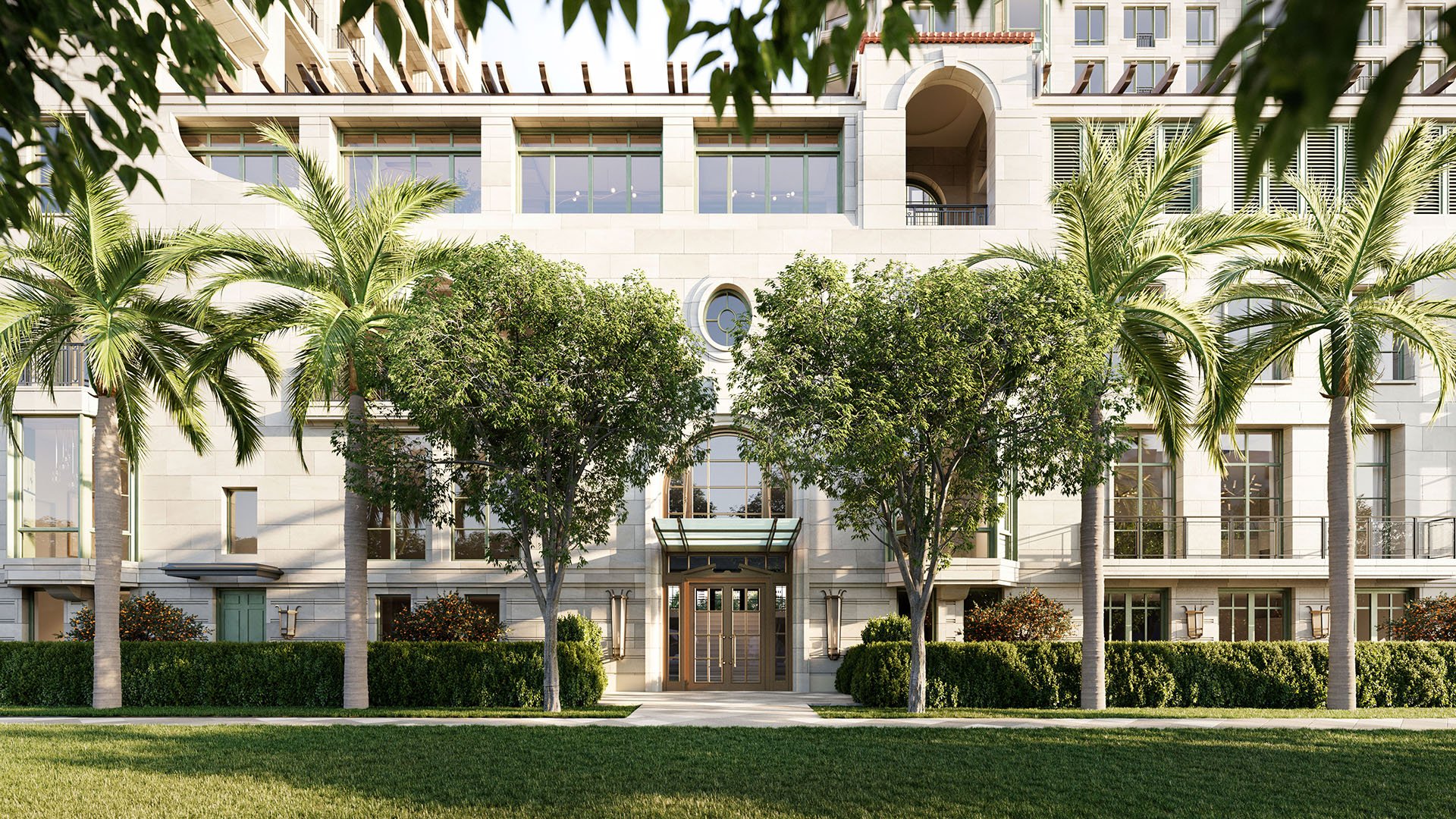 Palm-lined entrance facade at South Flagler House in West Palm Beach, highlighting luxury and ultra luxury condos with a formal streetside arrival framed by manicured greenery and stone architecture.