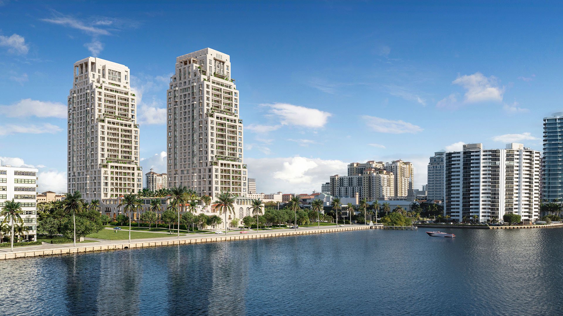 Daytime waterfront skyline view of the twin towers at South Flagler House in West Palm Beach, presenting luxury and ultra luxury condos with a prominent position along the water.