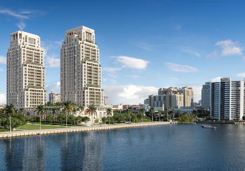 Daytime waterfront skyline view of the twin towers at South Flagler House in West Palm Beach, presenting luxury and ultra luxury condos with a prominent position along the water.